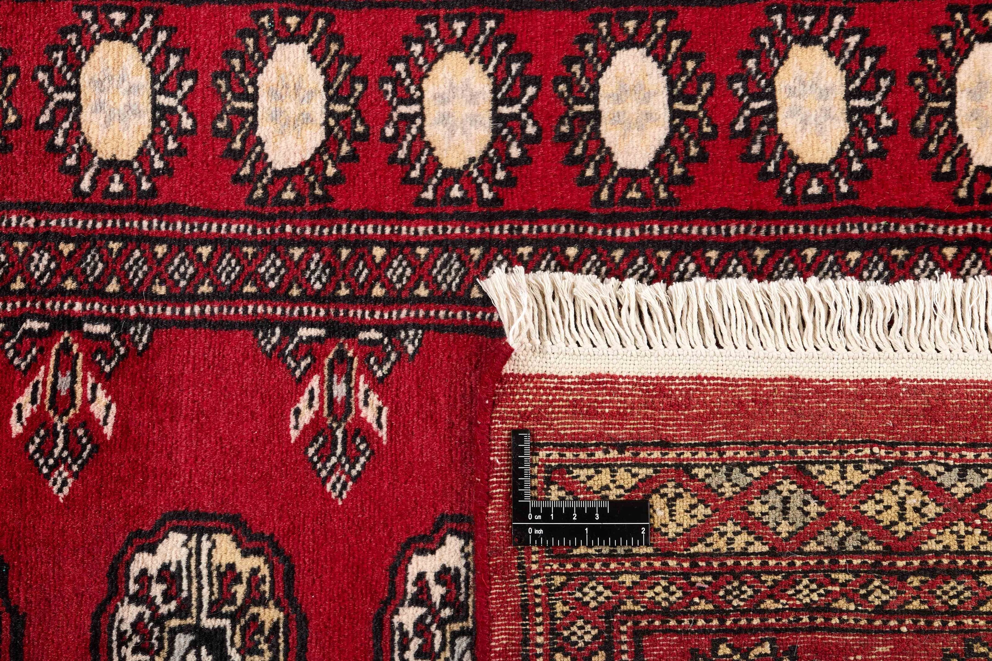 Red Oriental runner with traditional bordered pattern