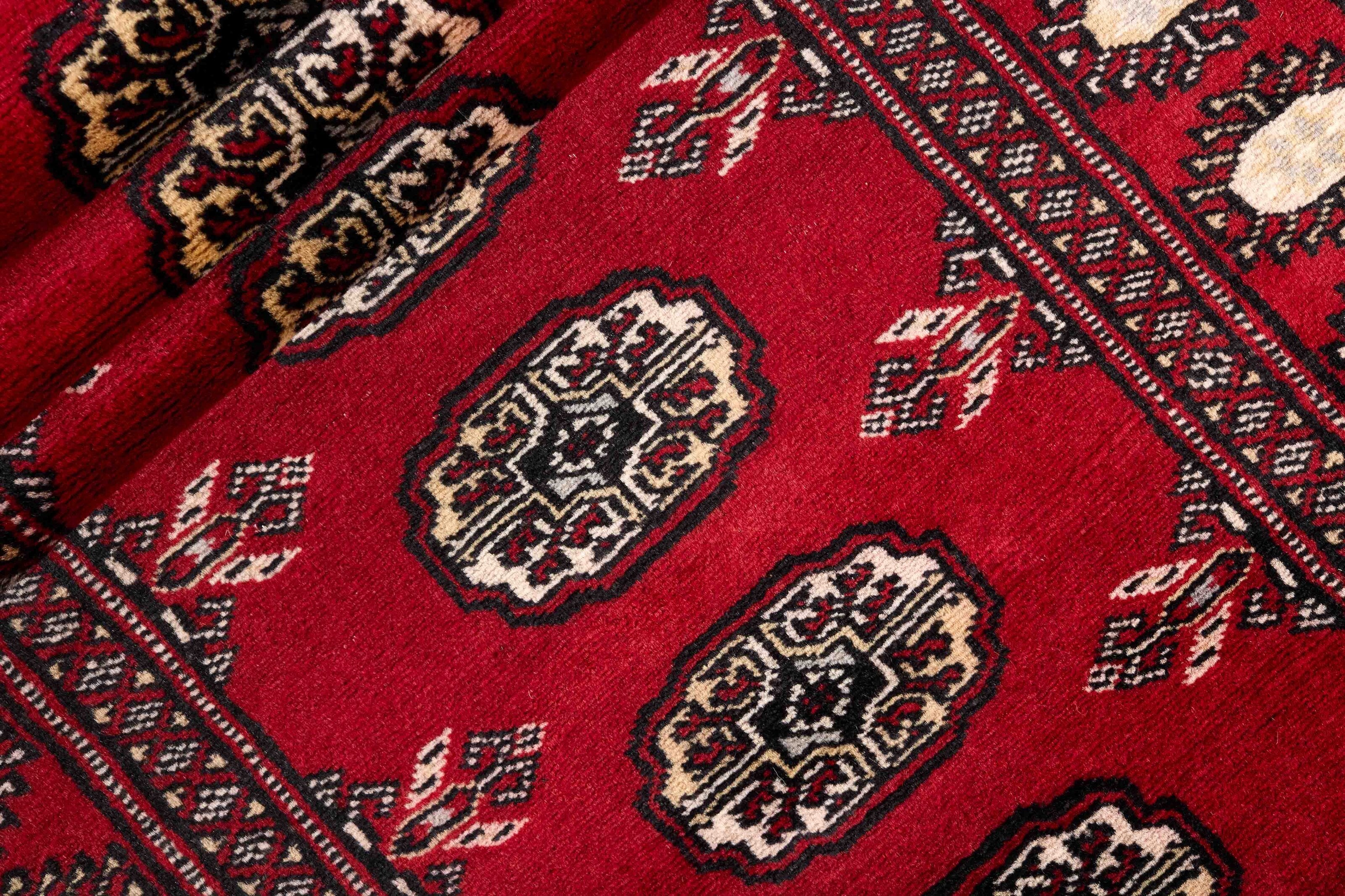 Red Oriental runner with traditional bordered pattern