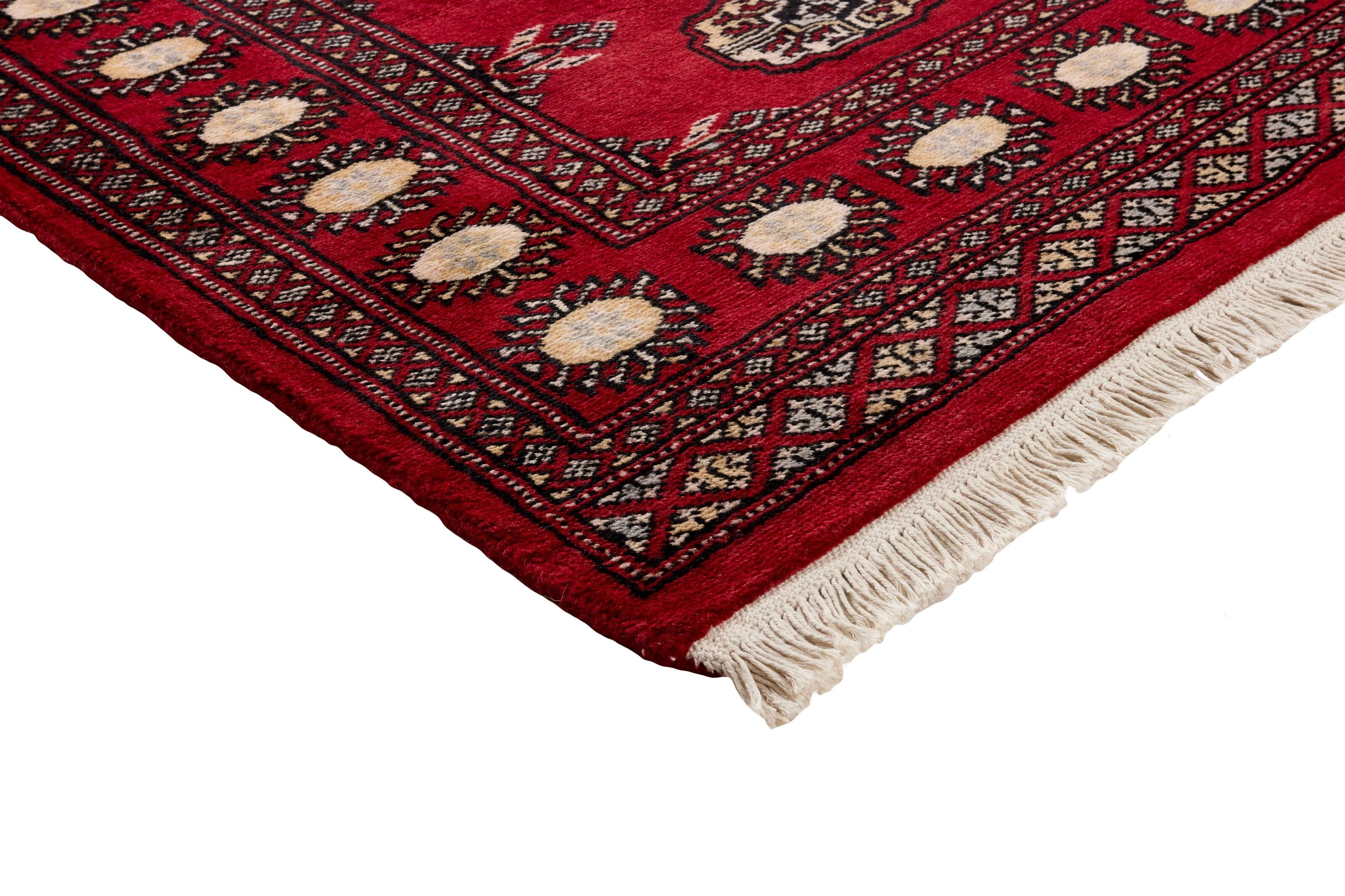 Red Oriental runner with traditional bordered pattern