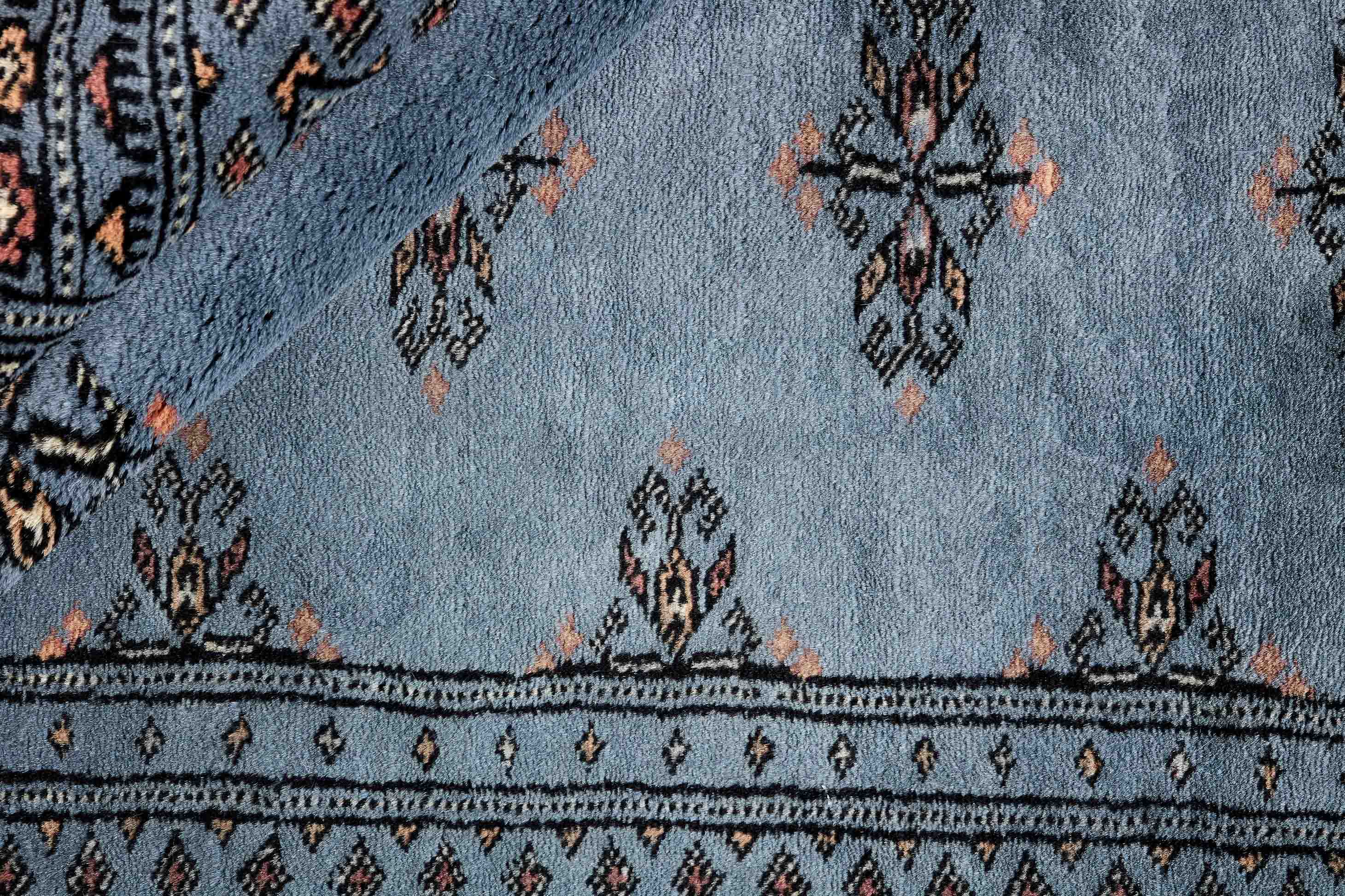 blue oriental rug with traditional pattern