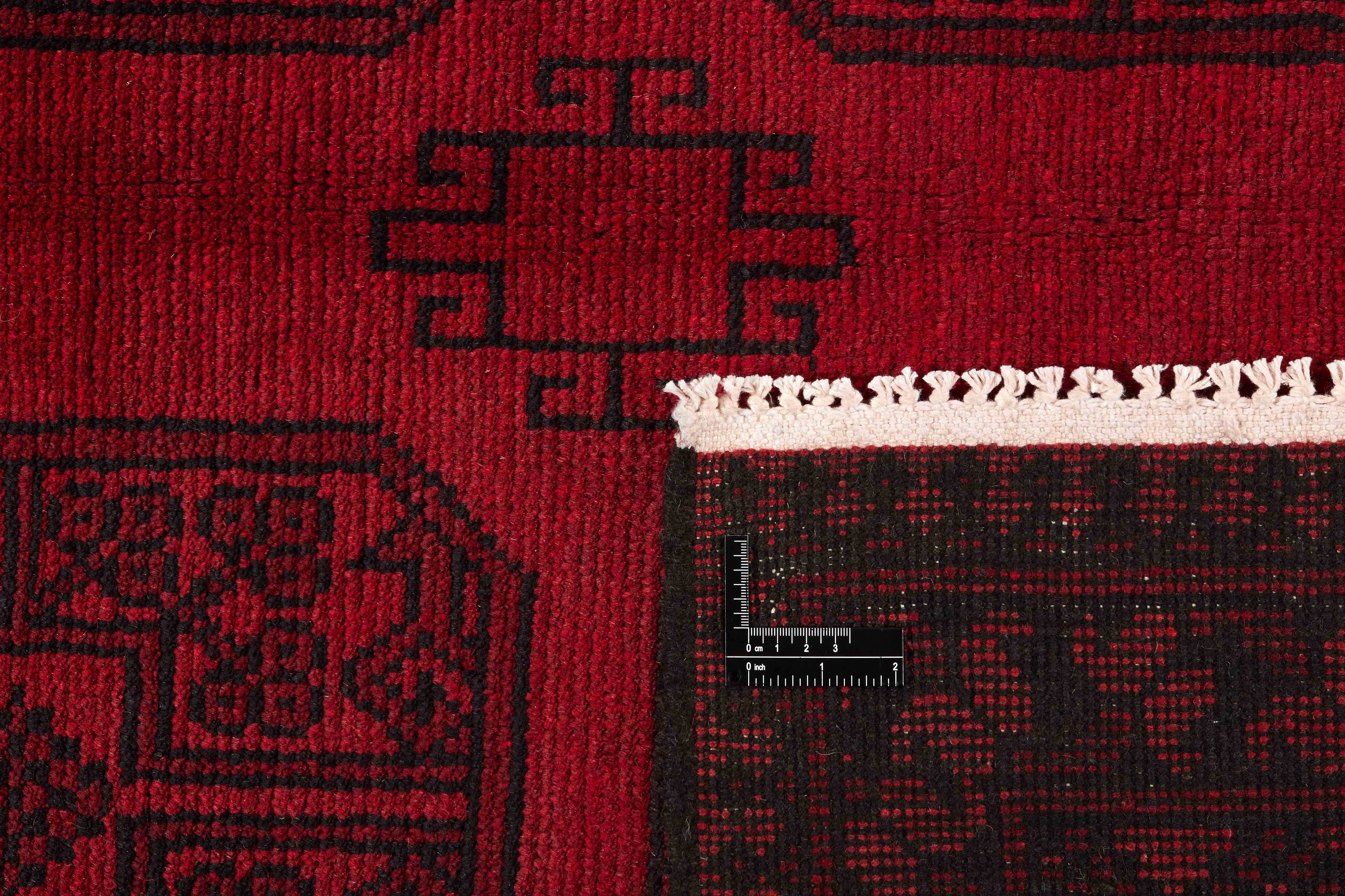 Red oriental rug with traditional elephant's foot pattern