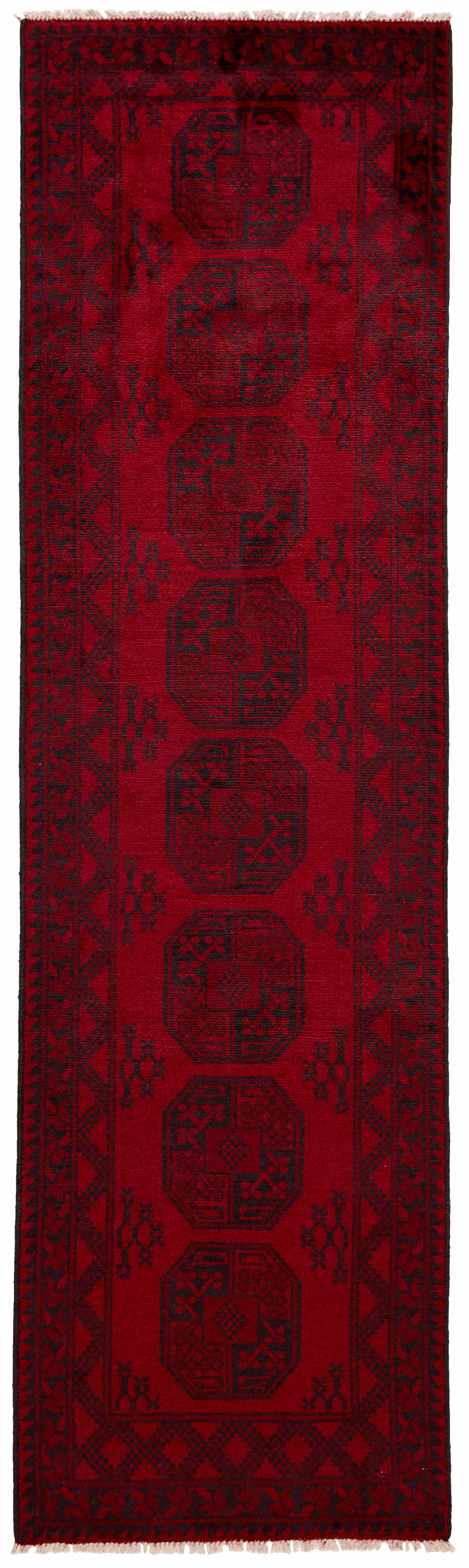 Red Oriental wool runner with a traditional elephant's foot pattern