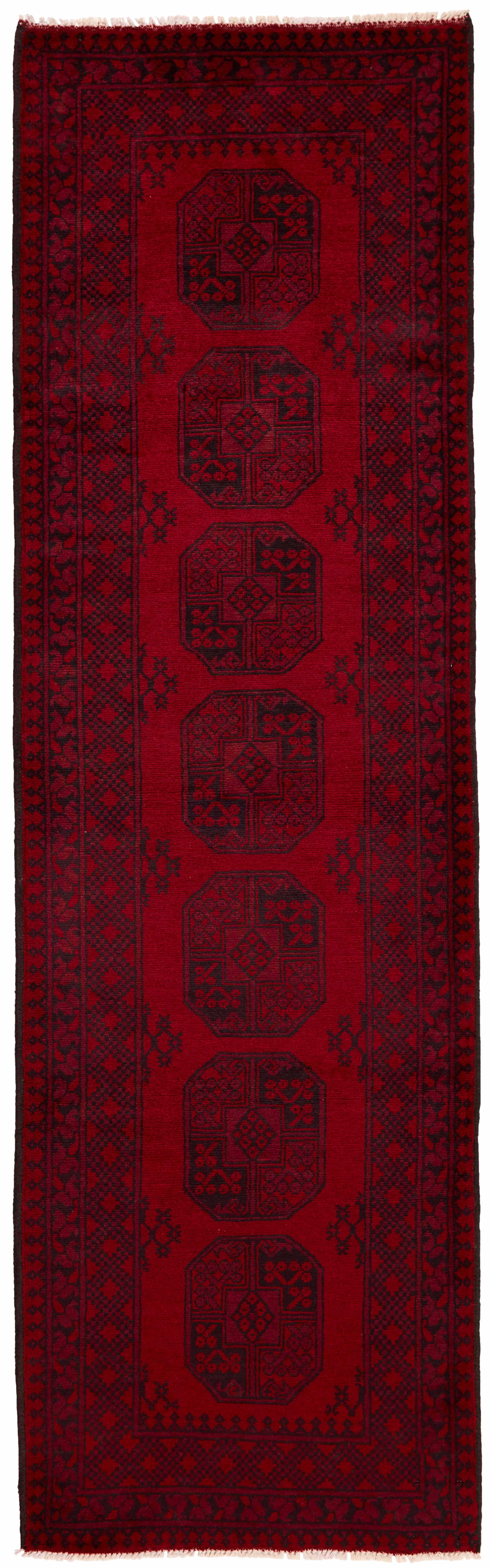 Red Oriental wool runner with a traditional elephant's foot pattern