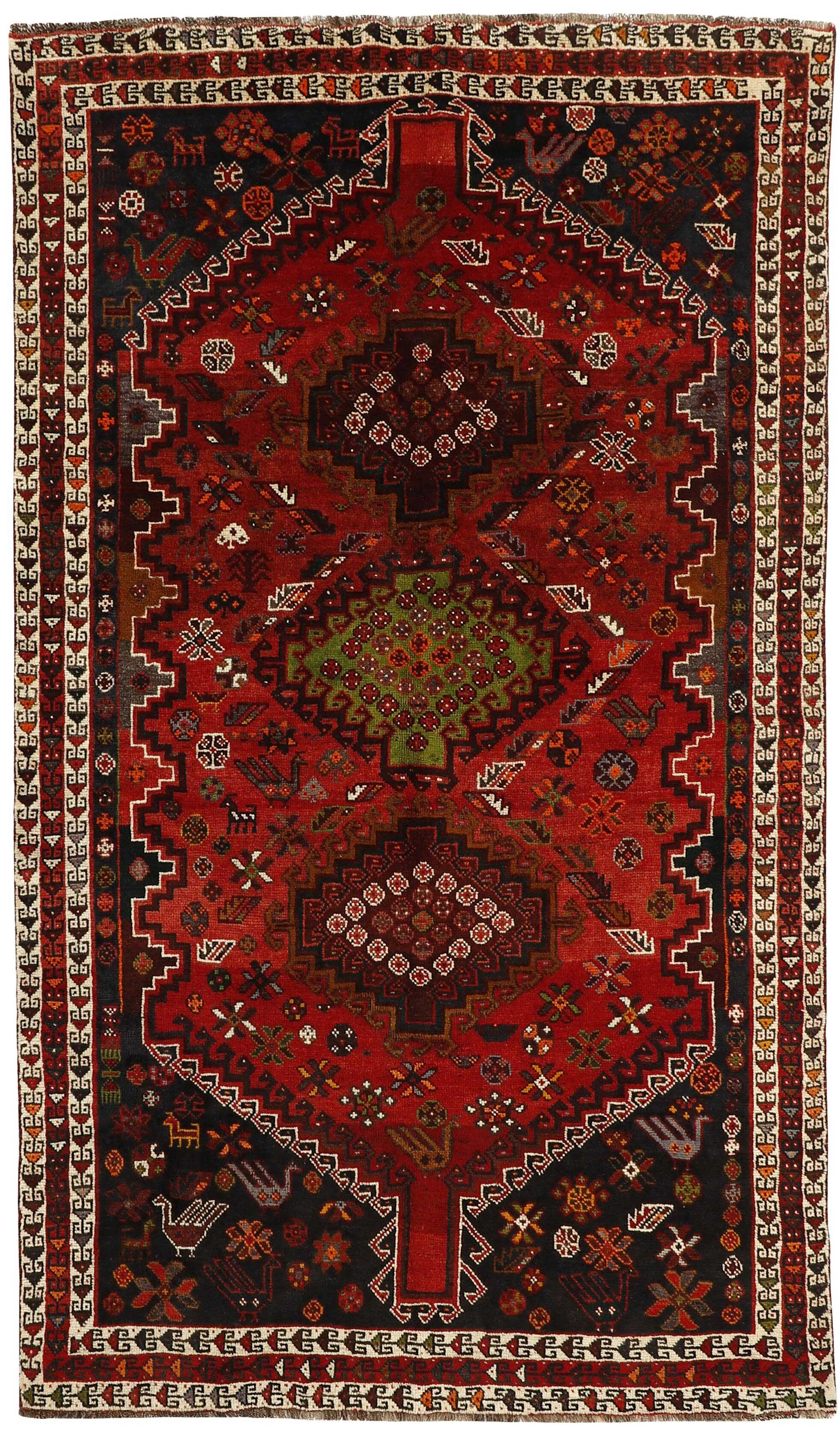 Authentic persian rug with a traditional tribal geometric pattern in red and black