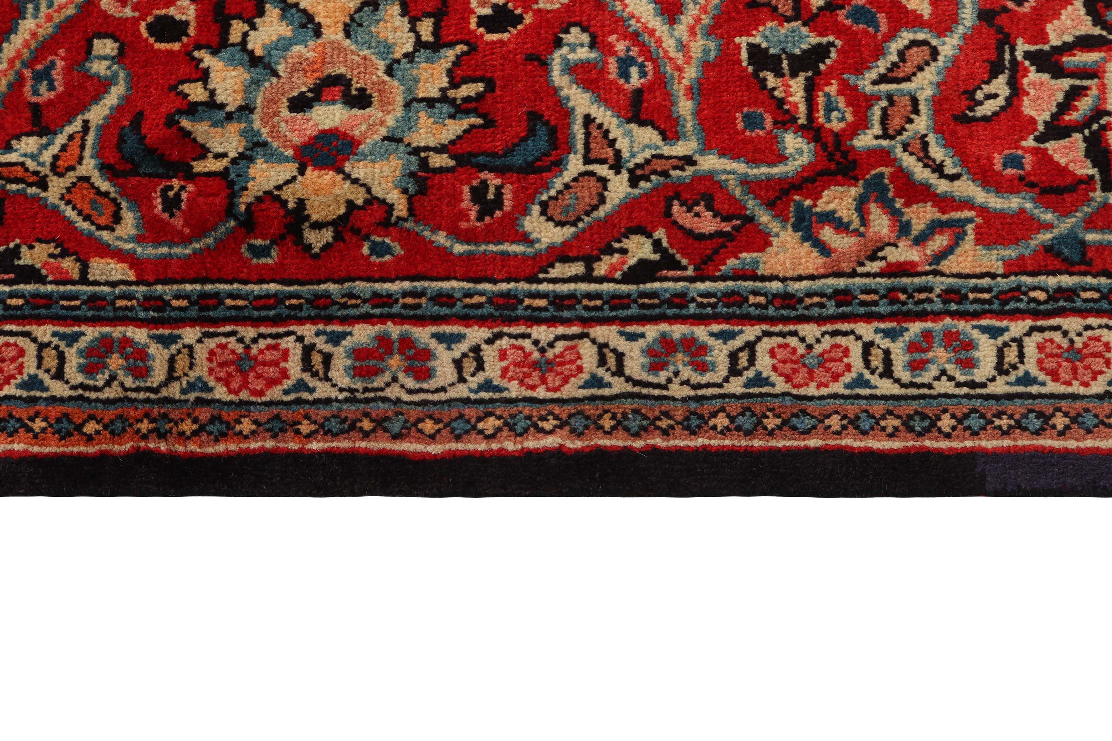 Large authentic persian rug with traditional floral pattern in red