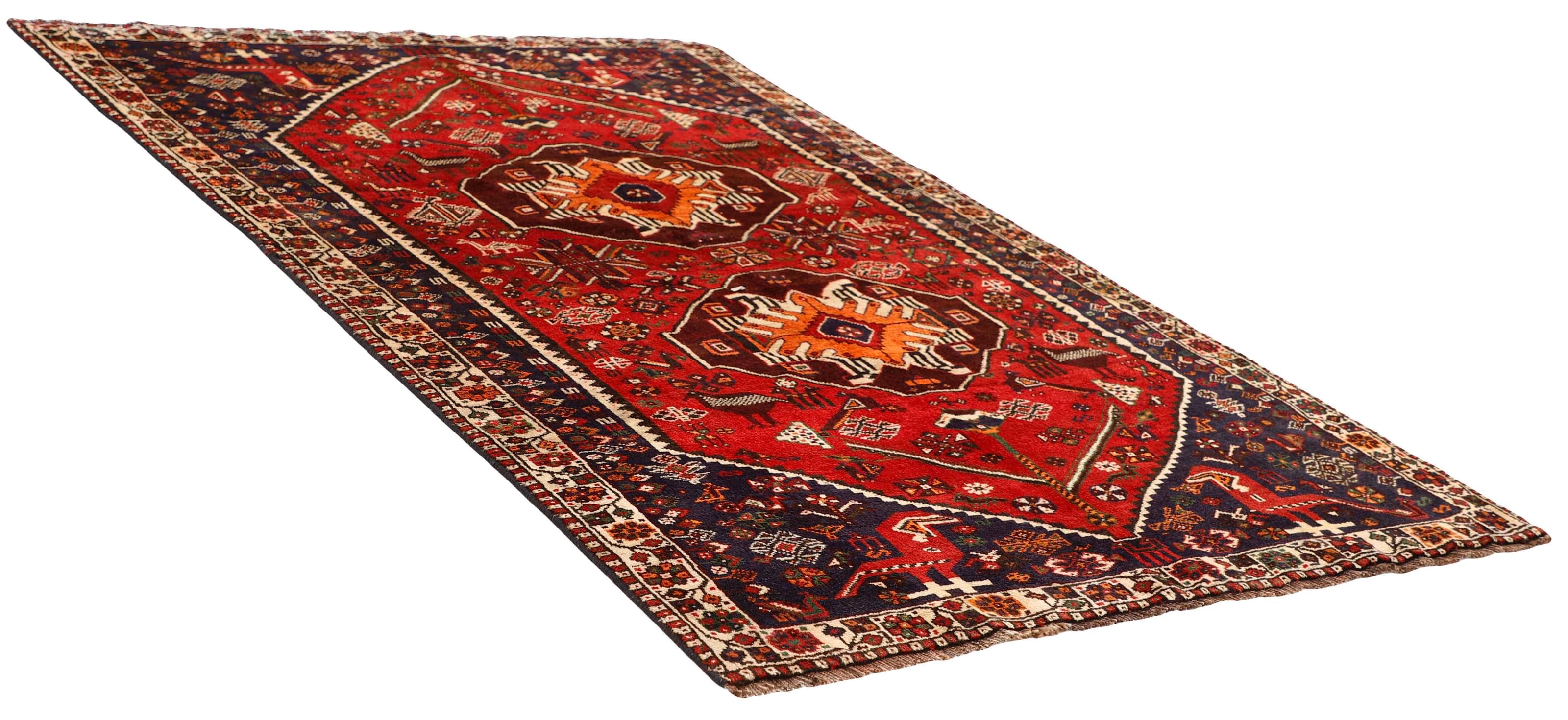Authentic persian rug with a traditional tribal geometric pattern in red