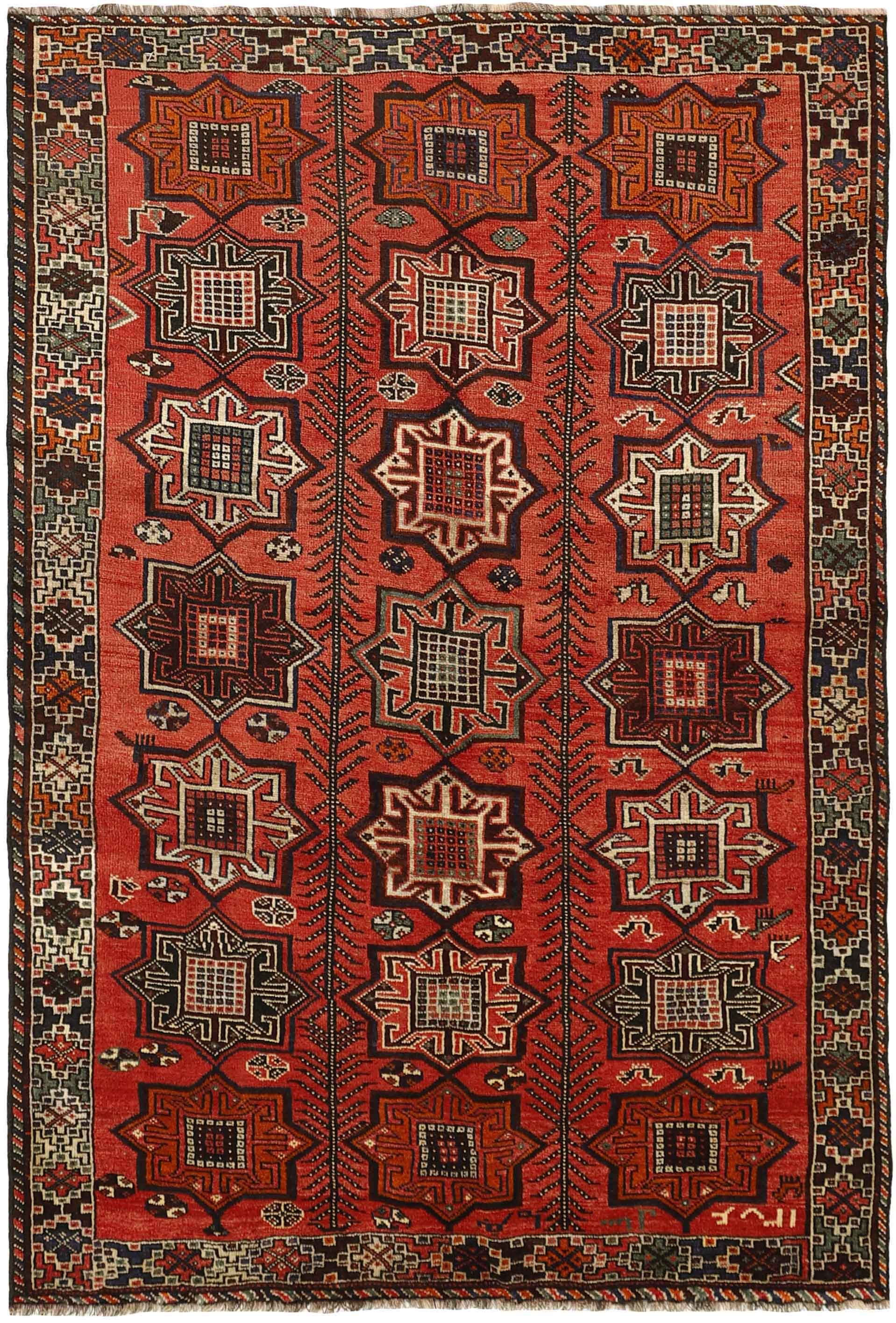 Authentic persian rug with a traditional tribal geometric pattern in red, black and beige