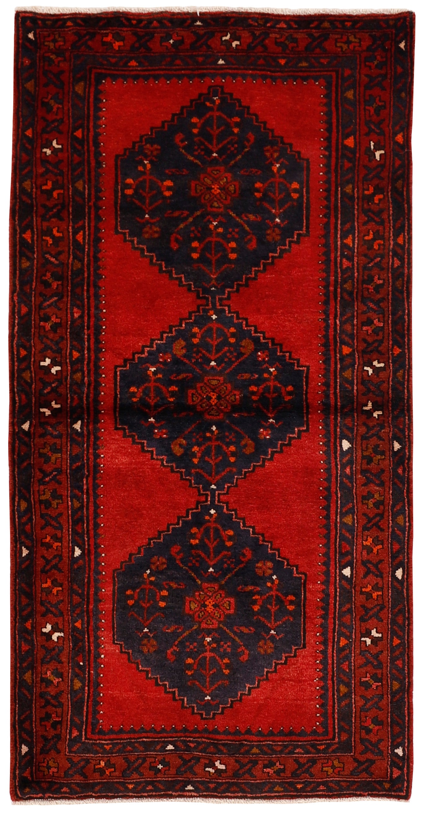 Authentic persian rug with stylised geometric design in red