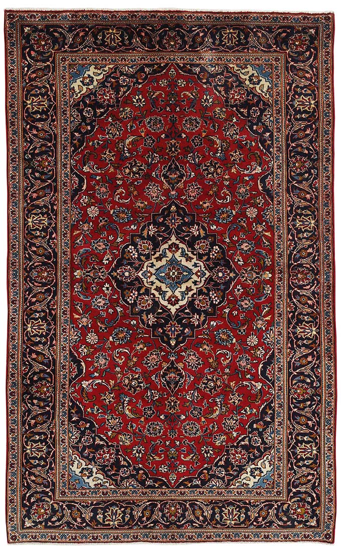 authentic persian rug with traditional floral design in red, blue, cream and black 
