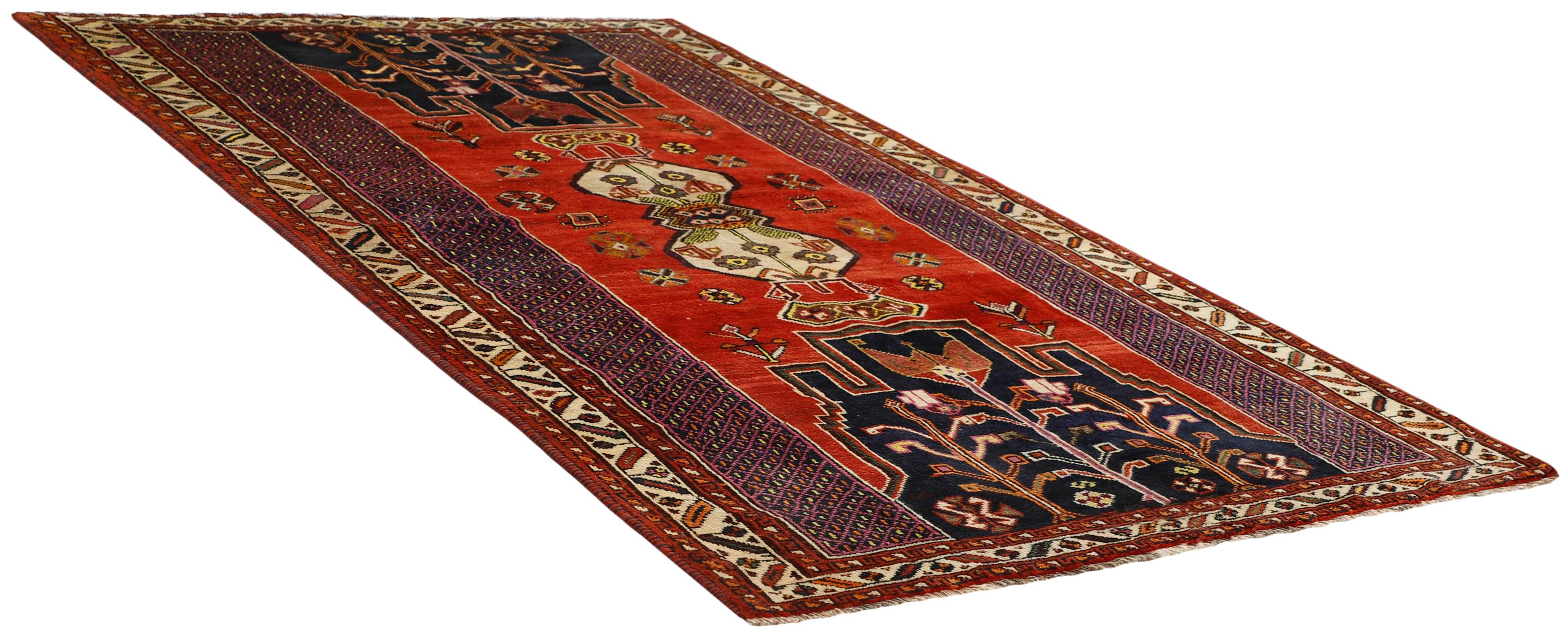 Authentic persian rug with a traditional tribal geometric pattern in red