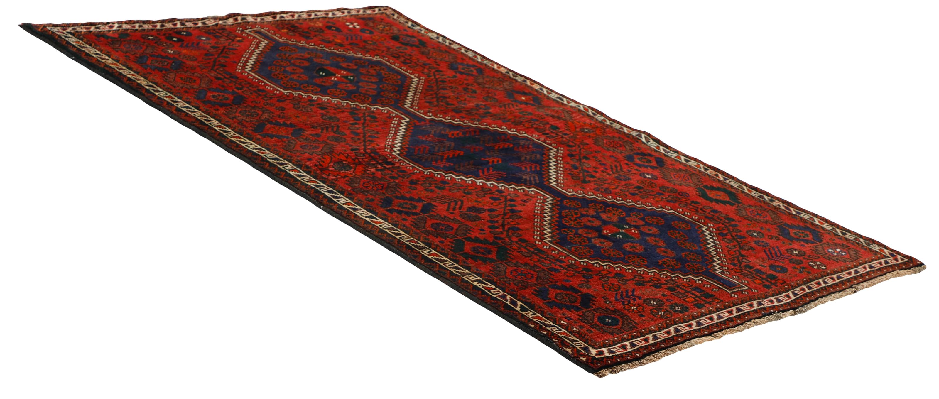 Authentic persian rug with a traditional tribal geometric pattern in red