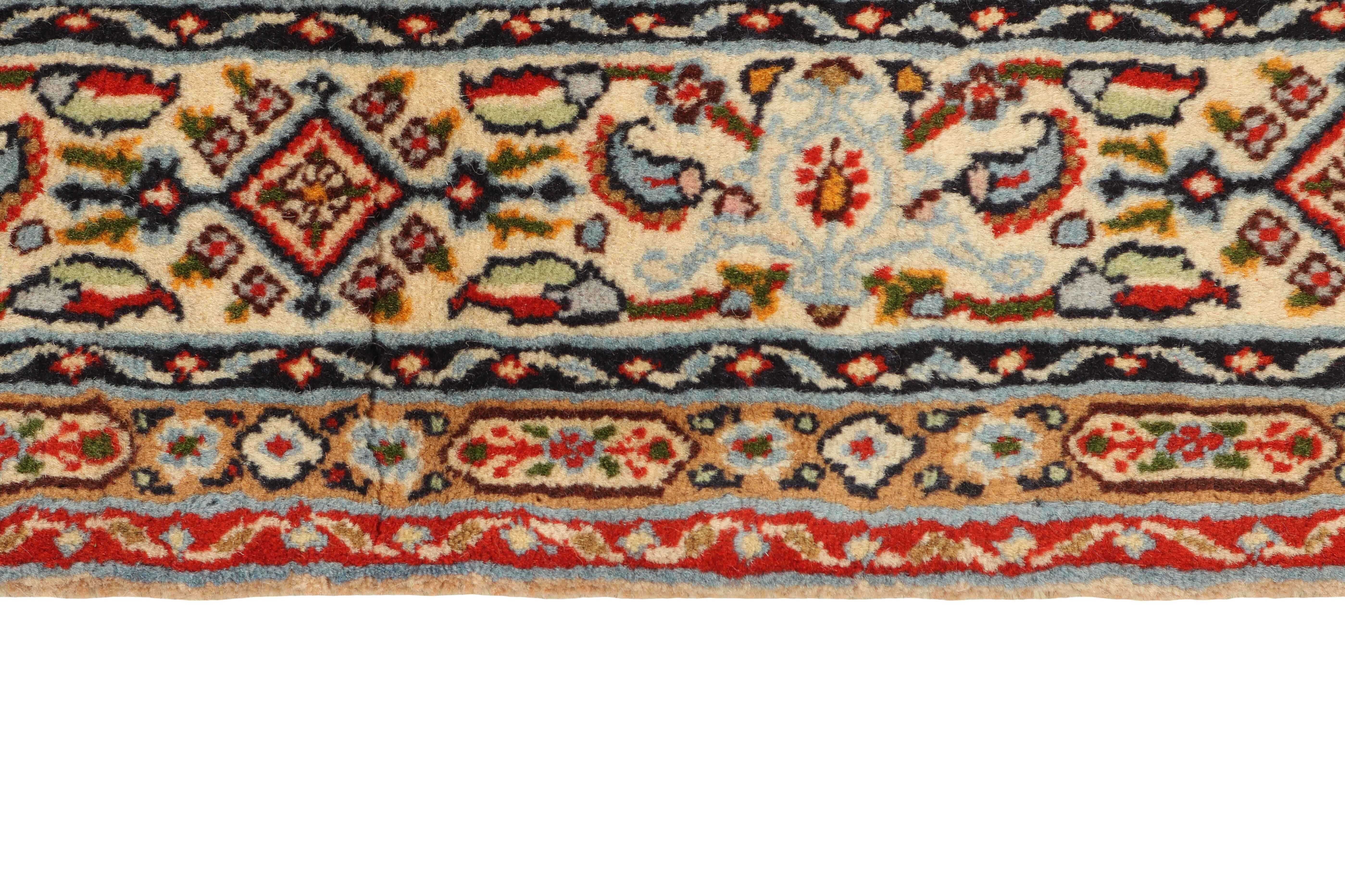 authentic persian rug with traditional floral pattern in cream