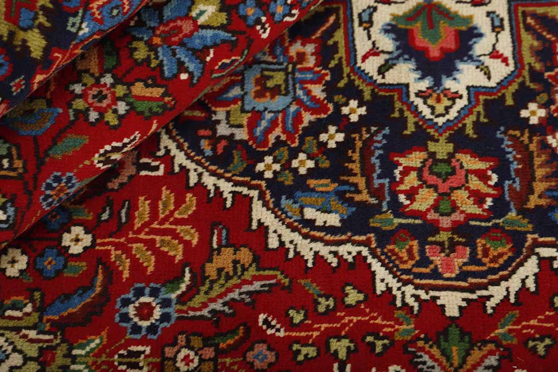 authentic persian rug with traditional floral design in red