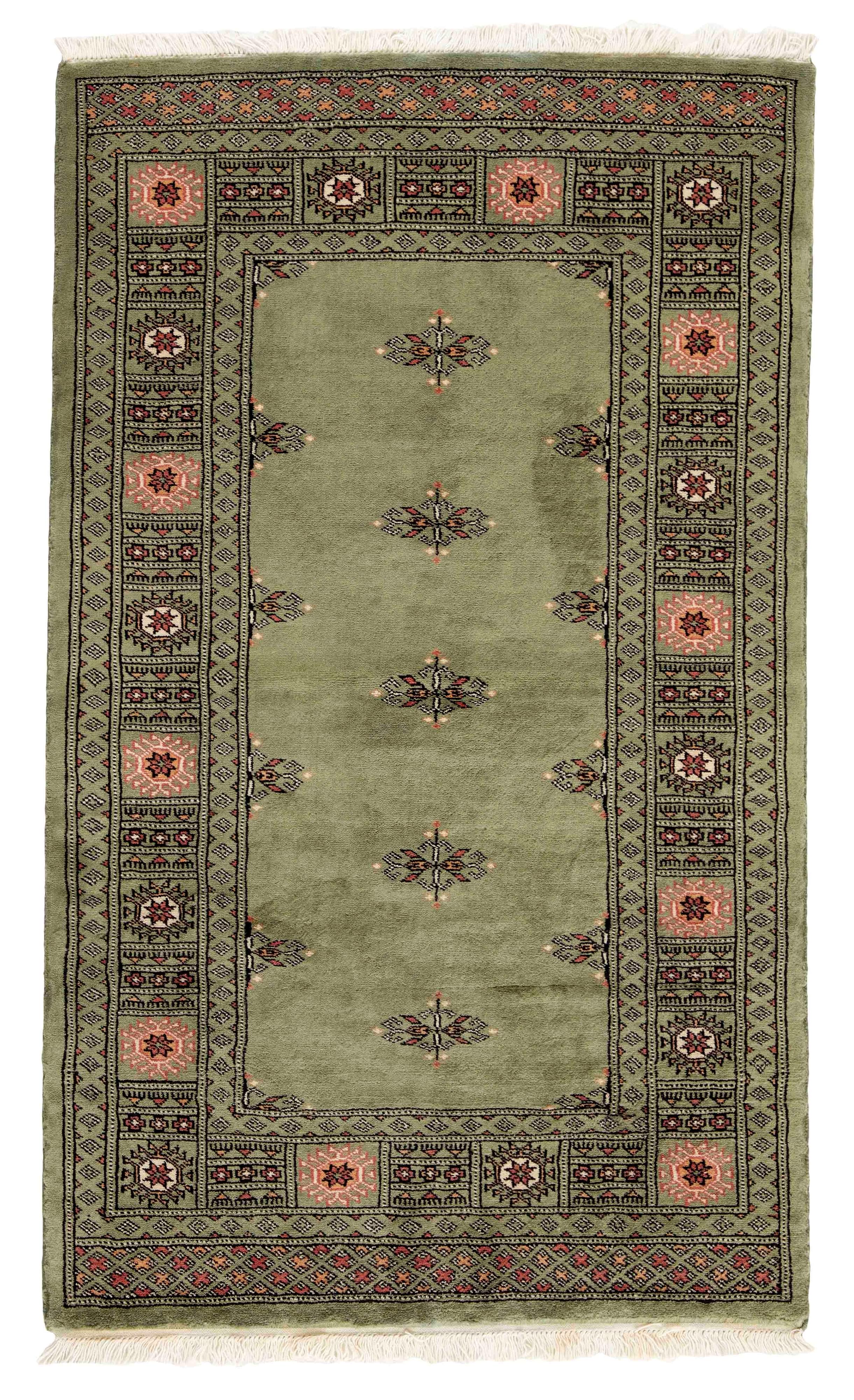 green oriental rug with traditional pattern