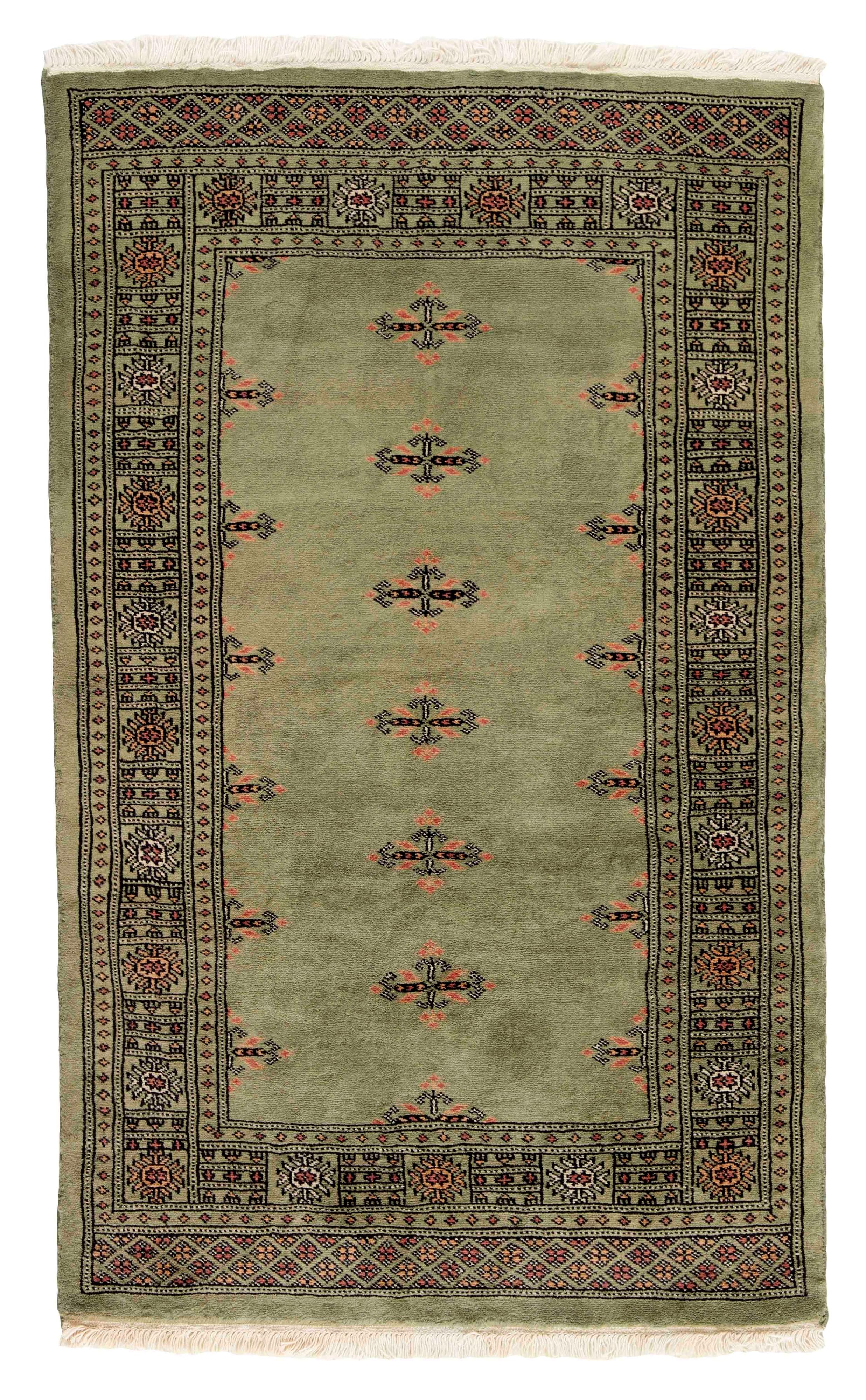 green oriental rug with traditional pattern