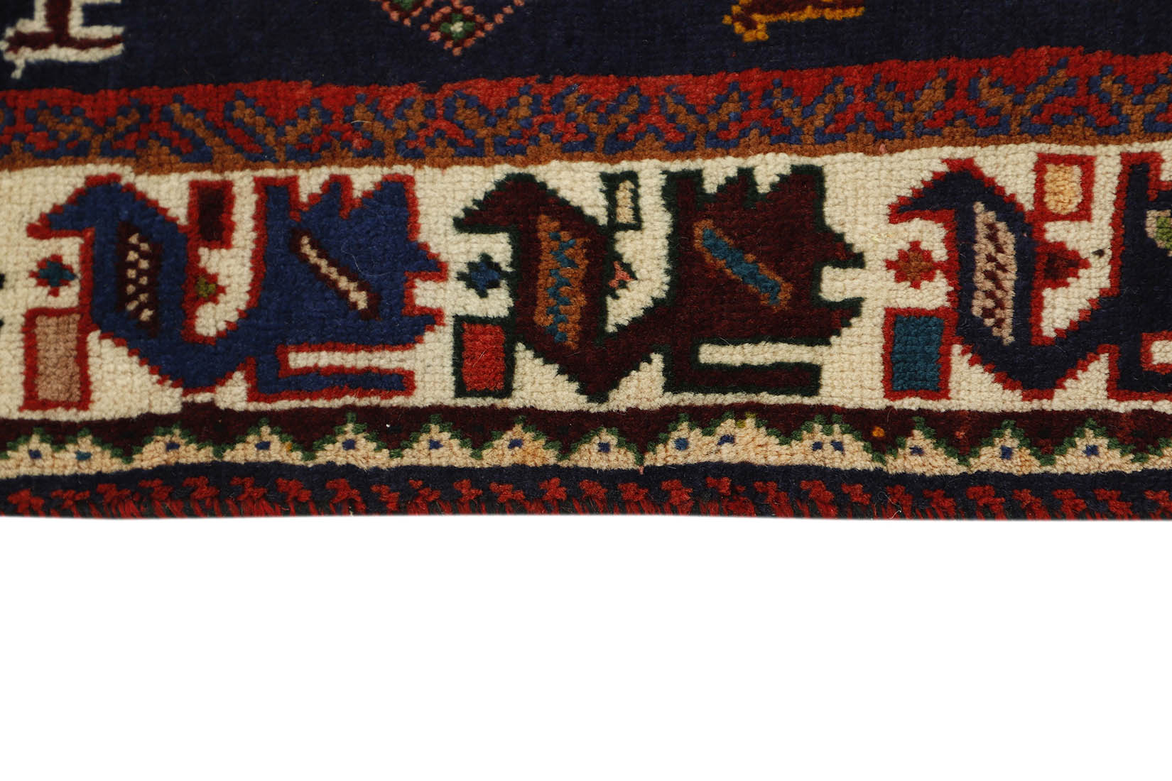 red and black persian rug with geometric design
