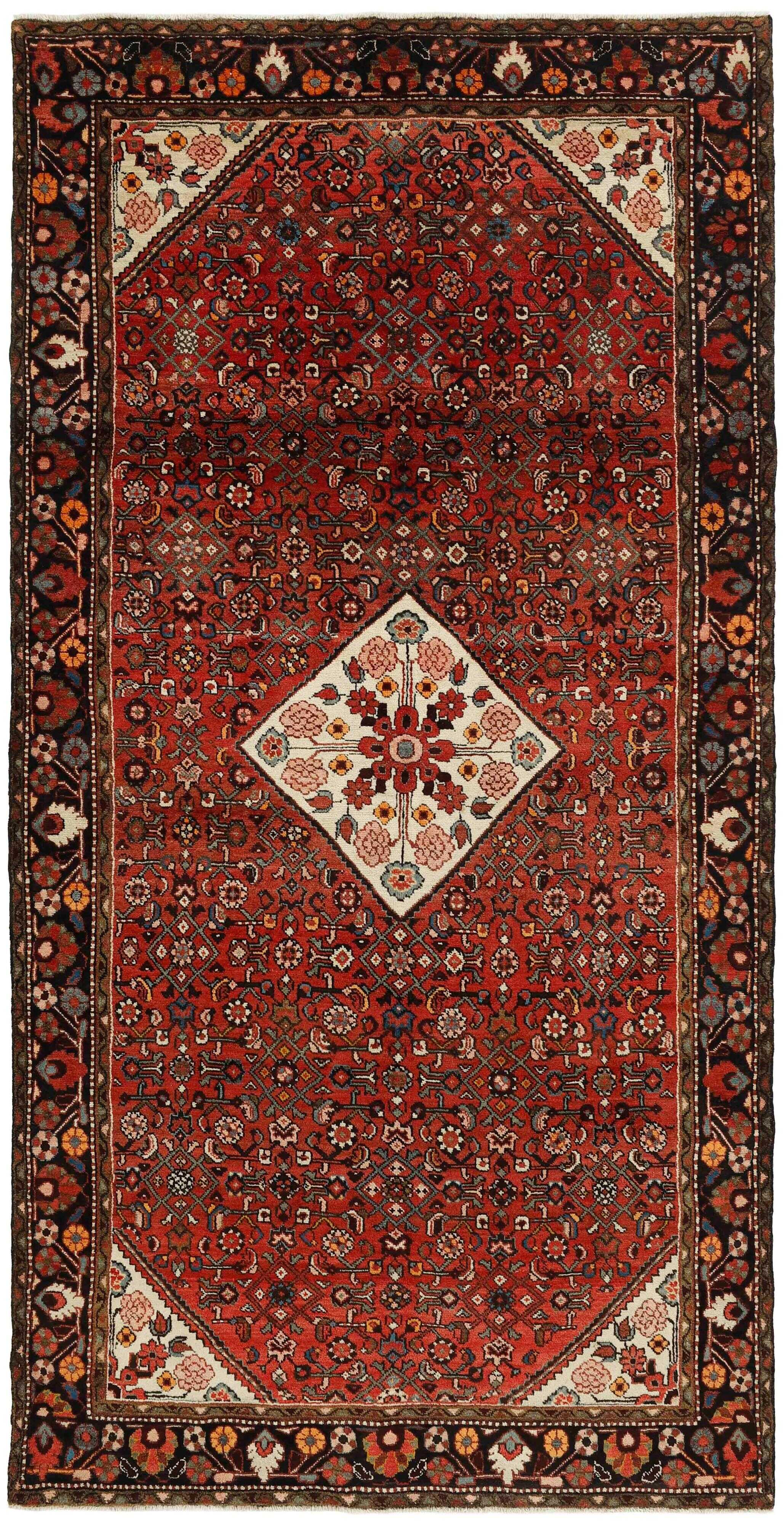 Red and black traditional persian rug with floral design