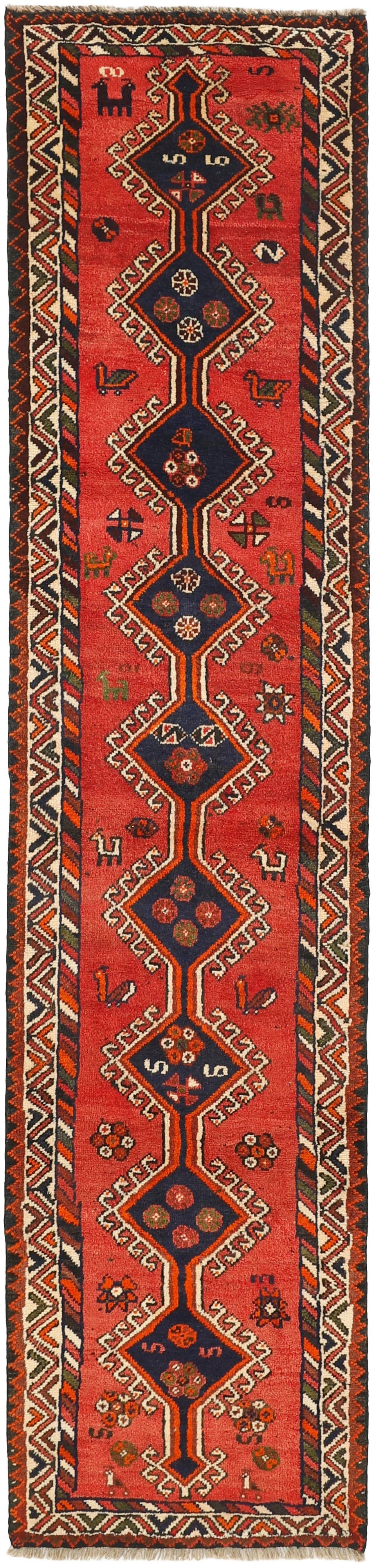 Authentic persian runner with a traditional tribal geometric pattern in red, brown and green