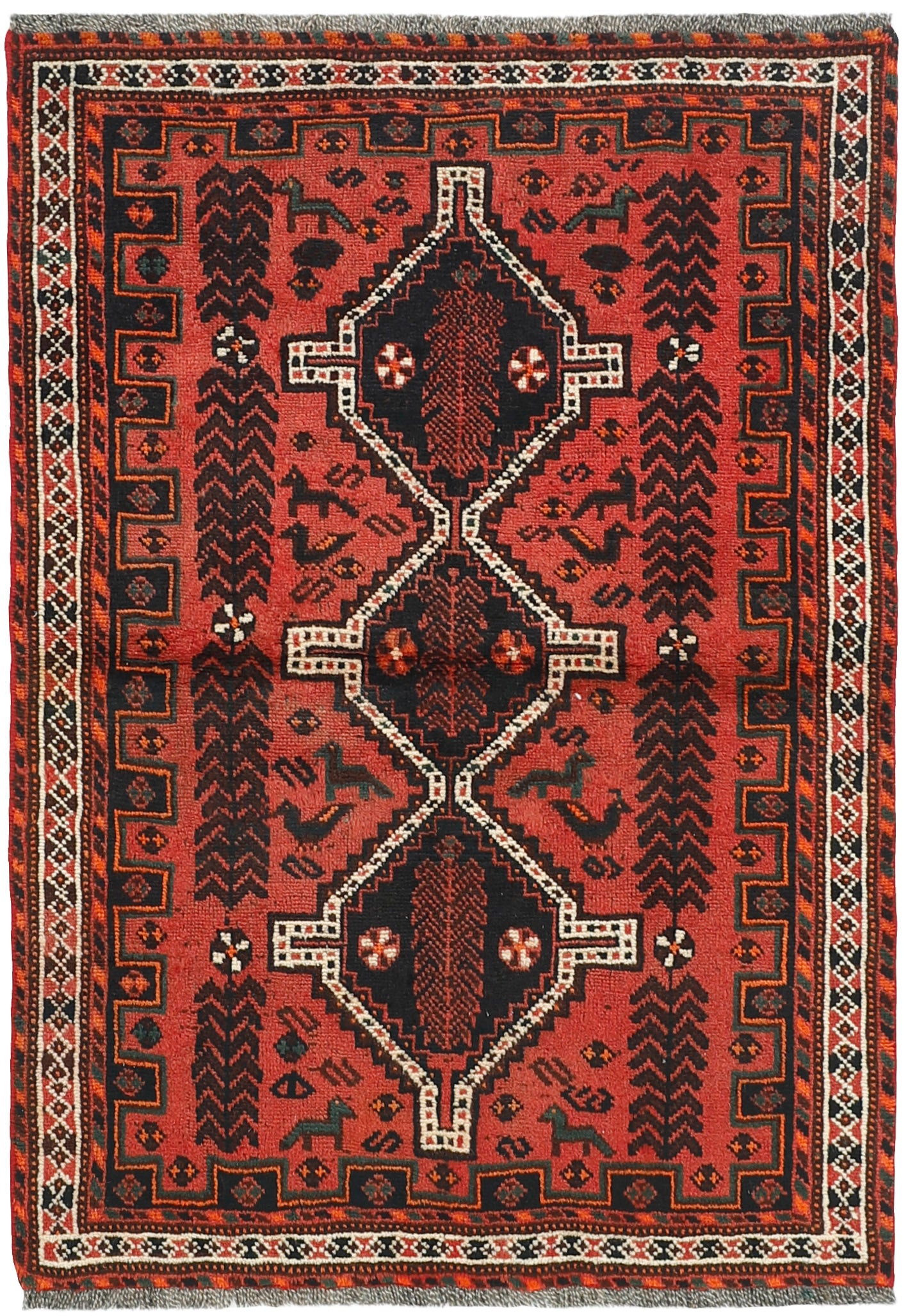 Authentic persian rug with a traditional tribal geometric pattern in red, black and ivory