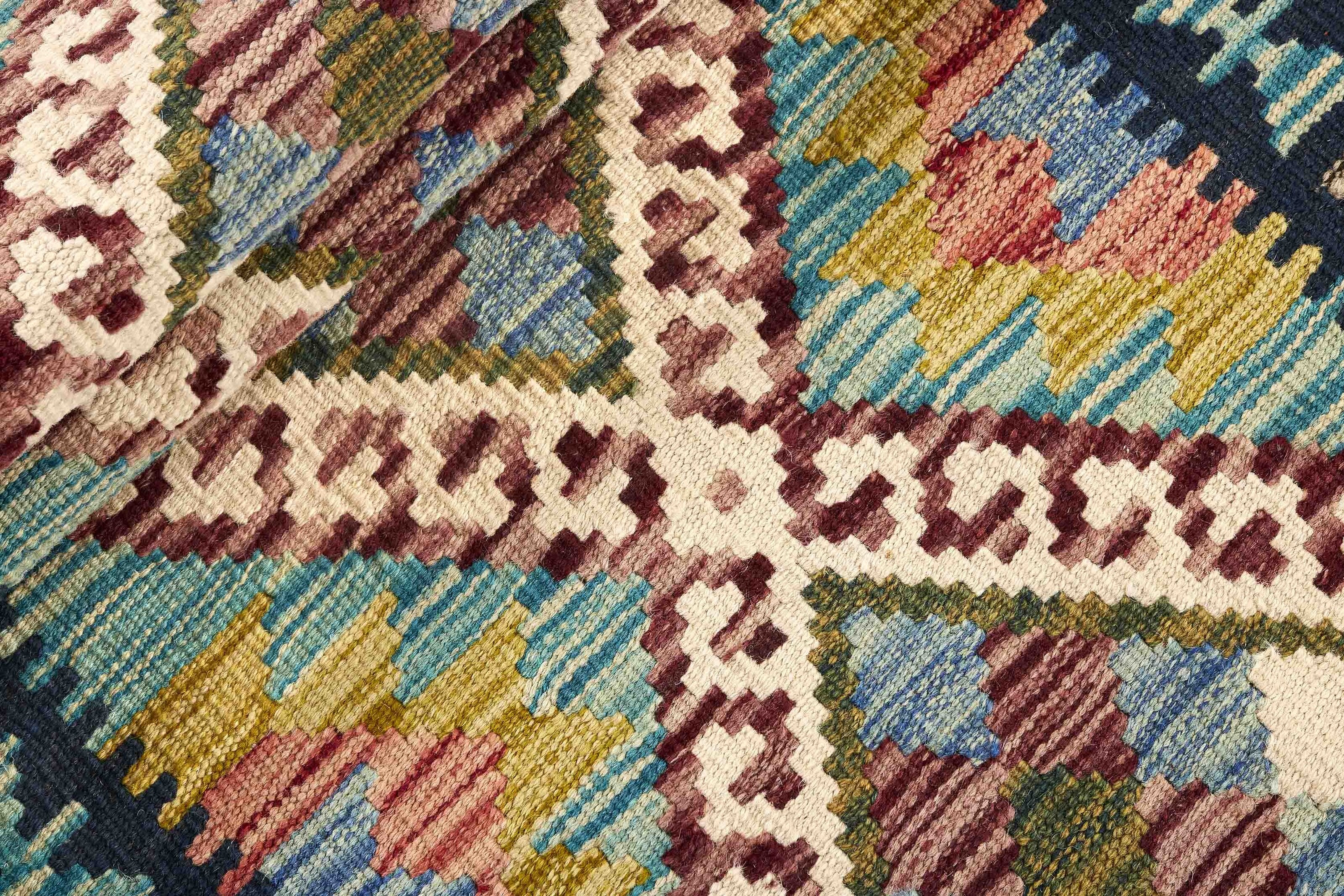 Authentic Afghan Kelim flatweave rug with traditional multicolour pattern.

