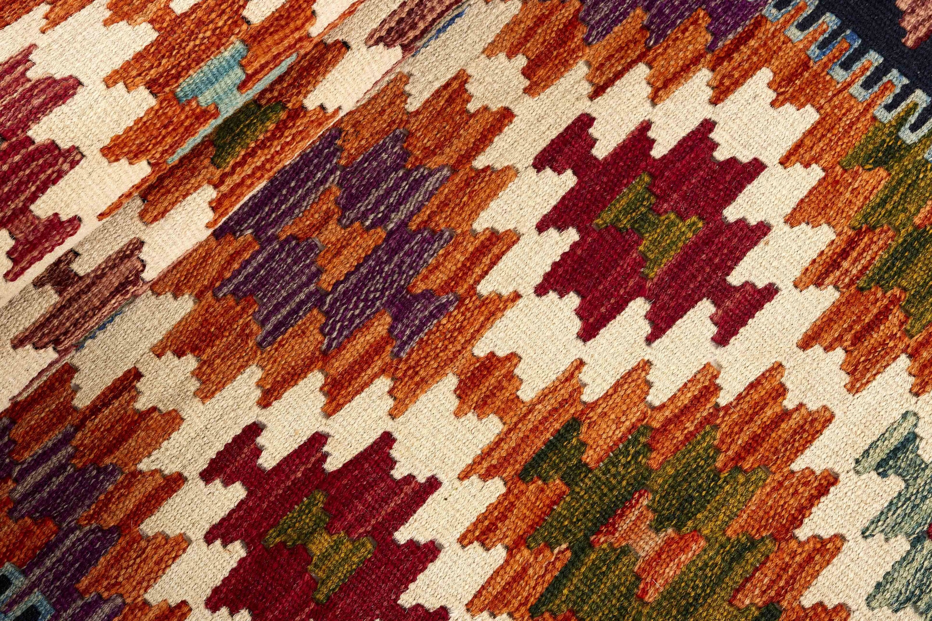 Authentic Afghan Kelim flatweave rug with traditional multicolour pattern.

