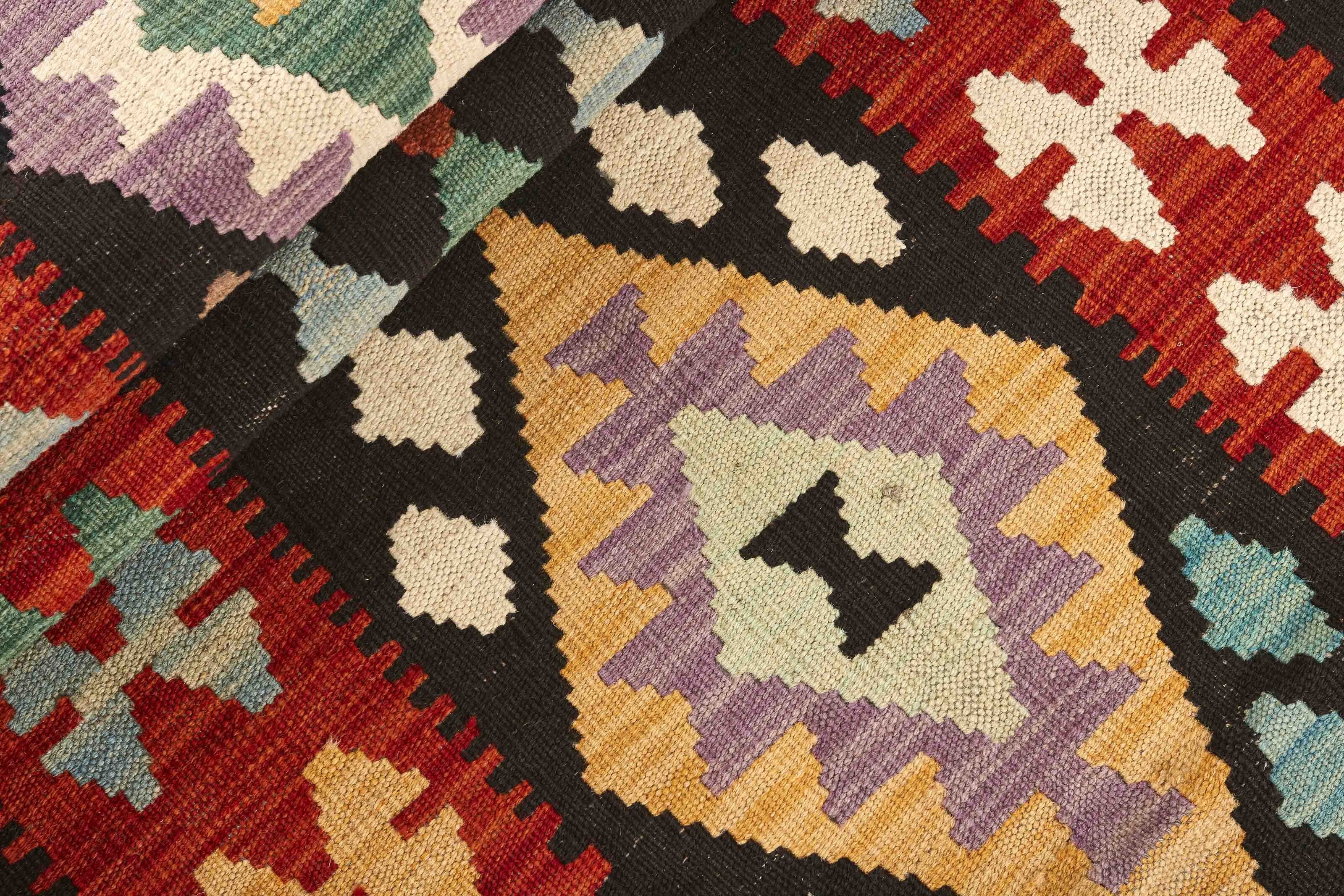 Authentic Afghan Kelim flatweave rug with traditional multicolour pattern.

