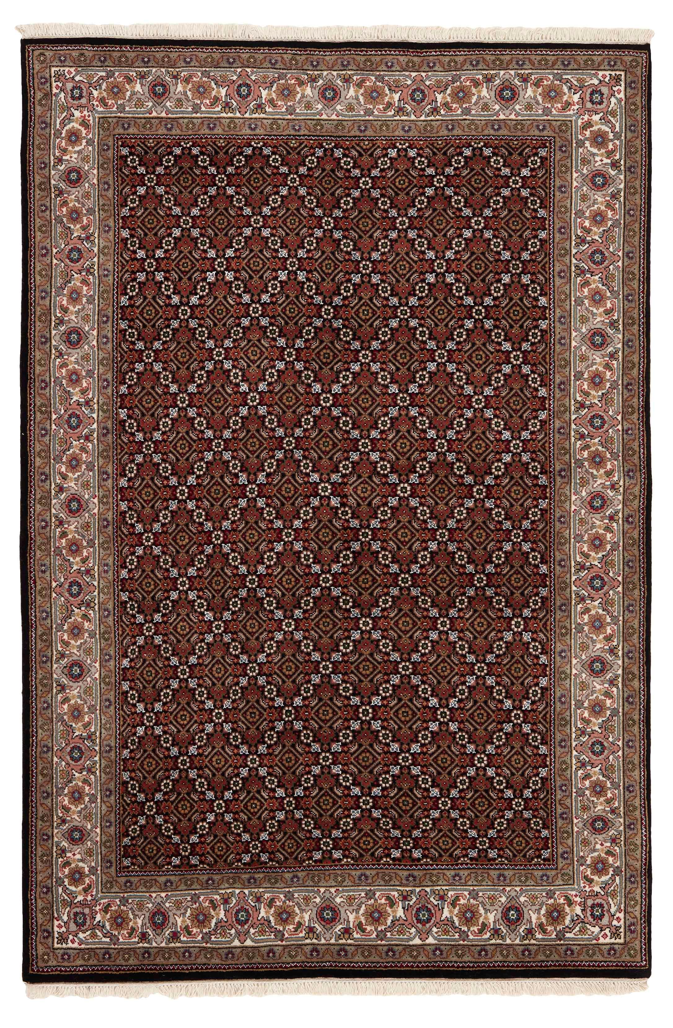 Authentic Oriental rug with traditional geometric and floral design in beige, blue, green and black