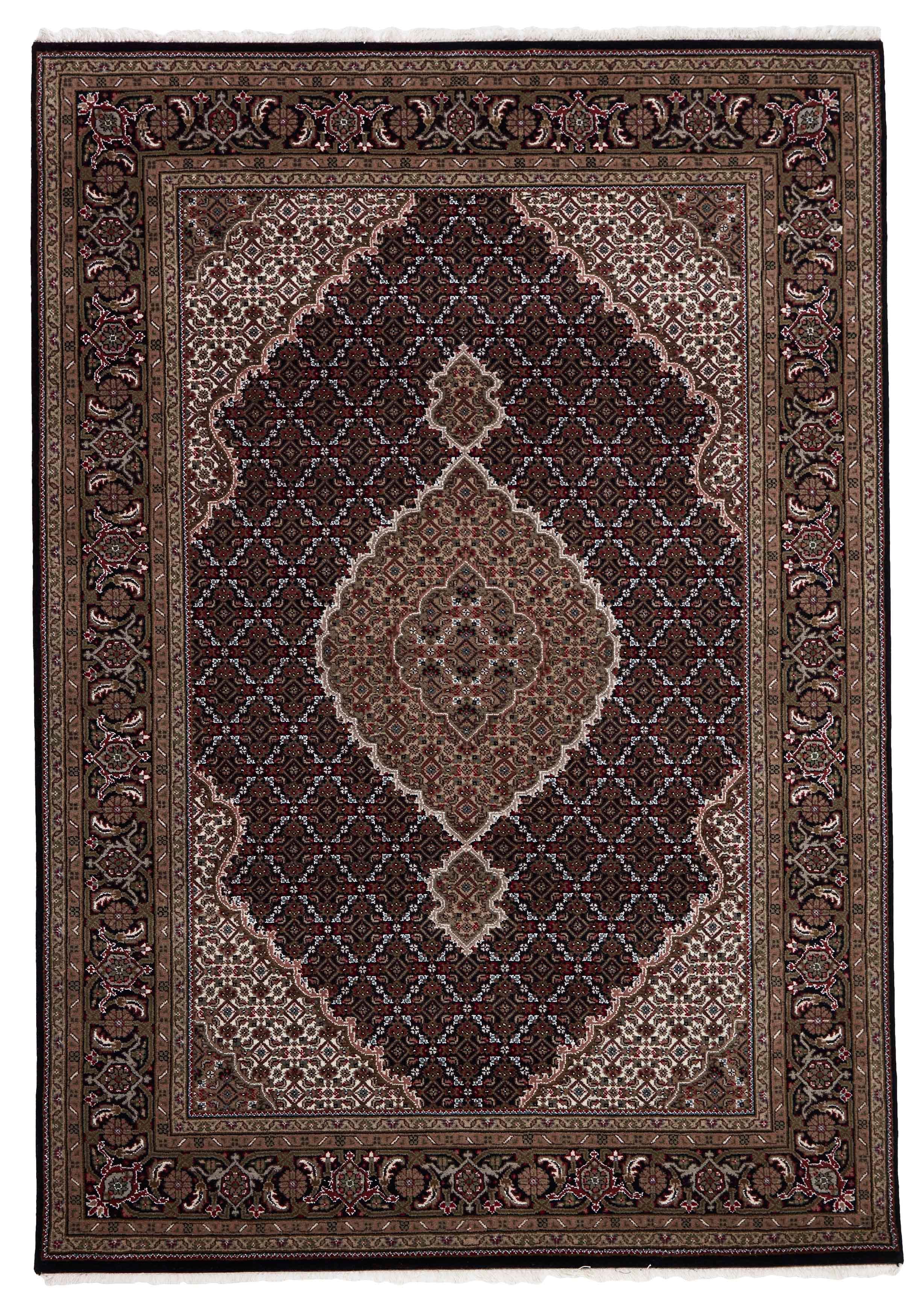 Authentic Oriental rug with traditional geometric and floral design in beige, blue, green and black