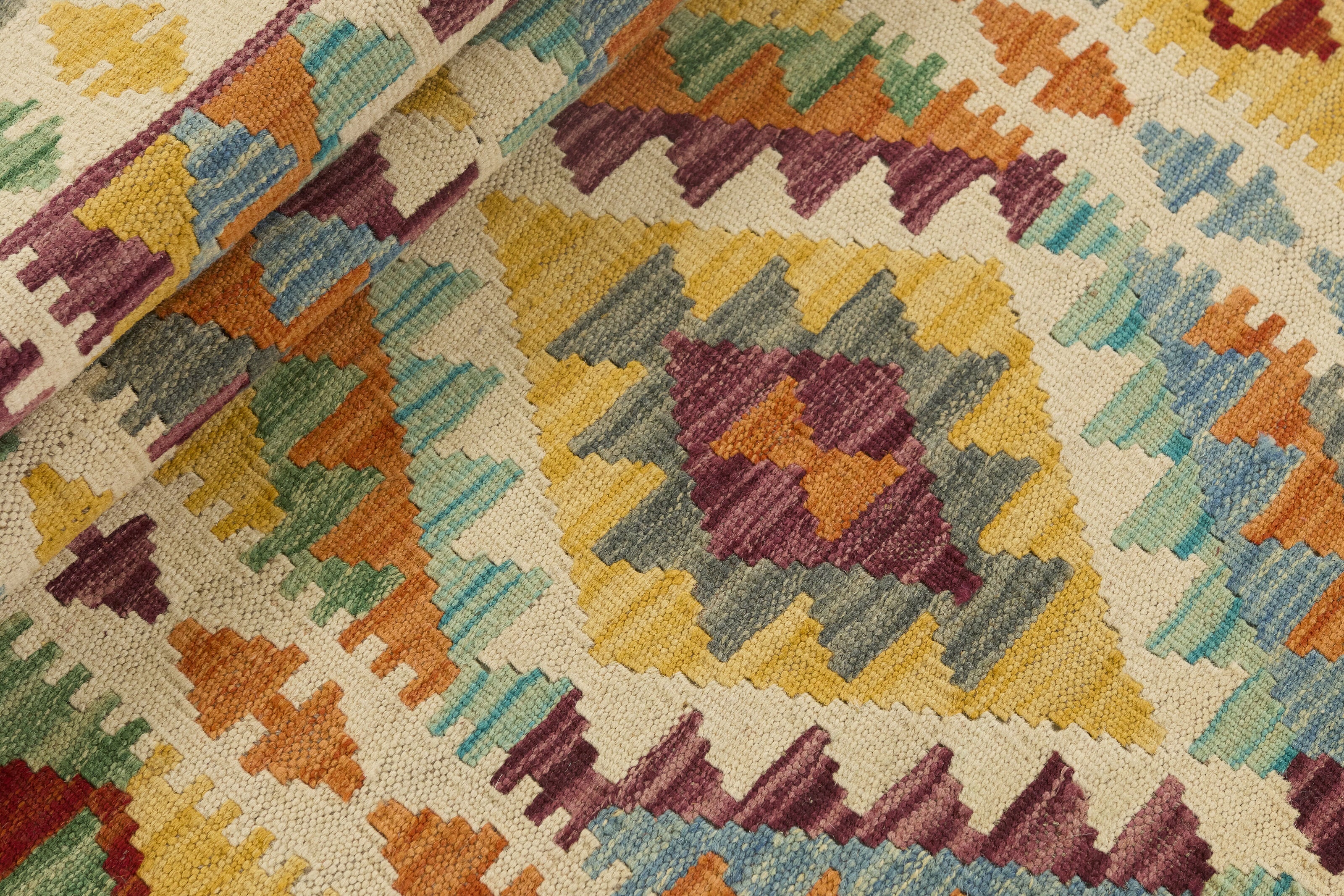 Authentic Afghan Kelim flatweave rug with traditional multicolour pattern.

