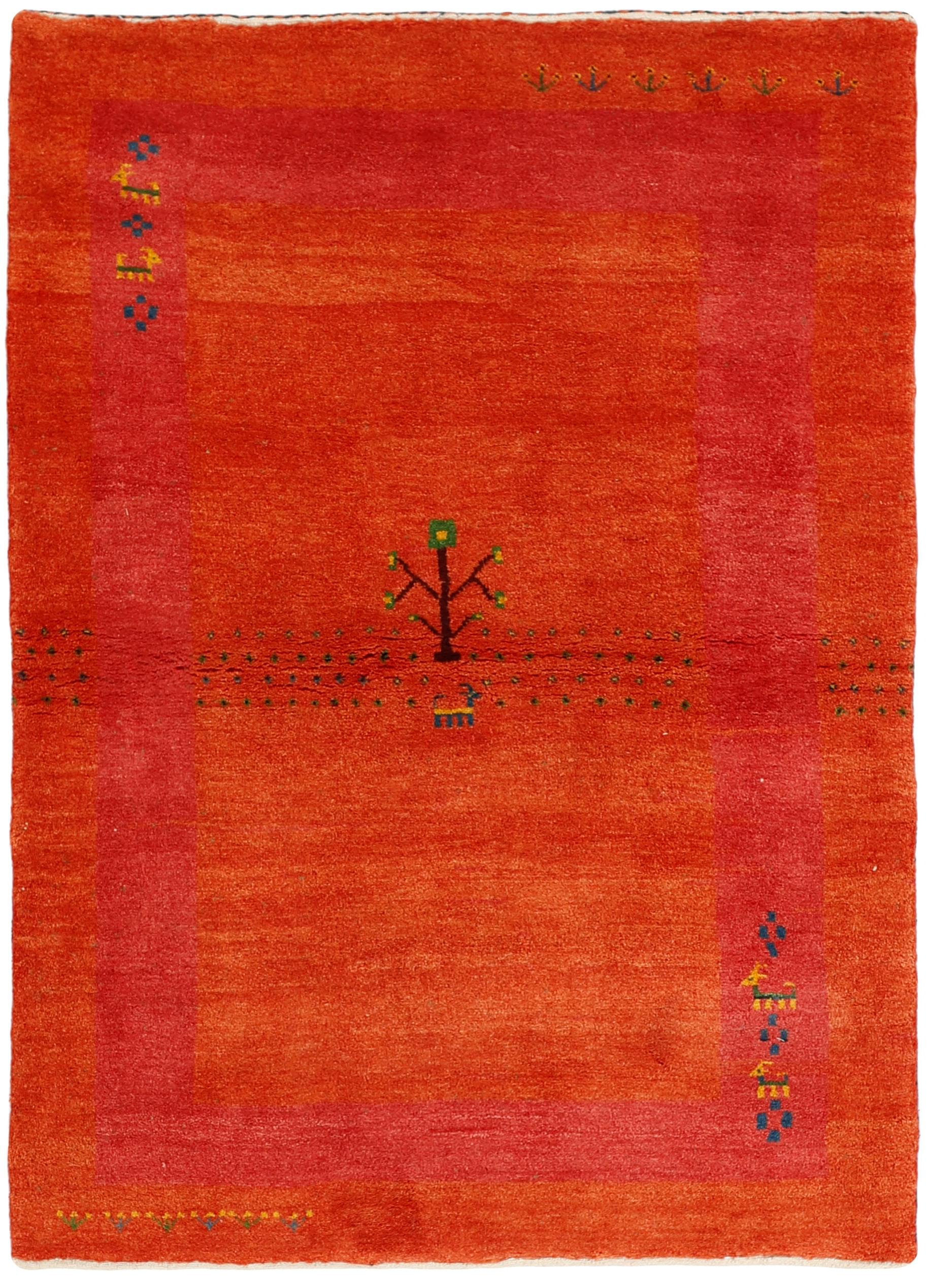 authentic persian rug with geometric tribal design in beige, red, yellow and blue