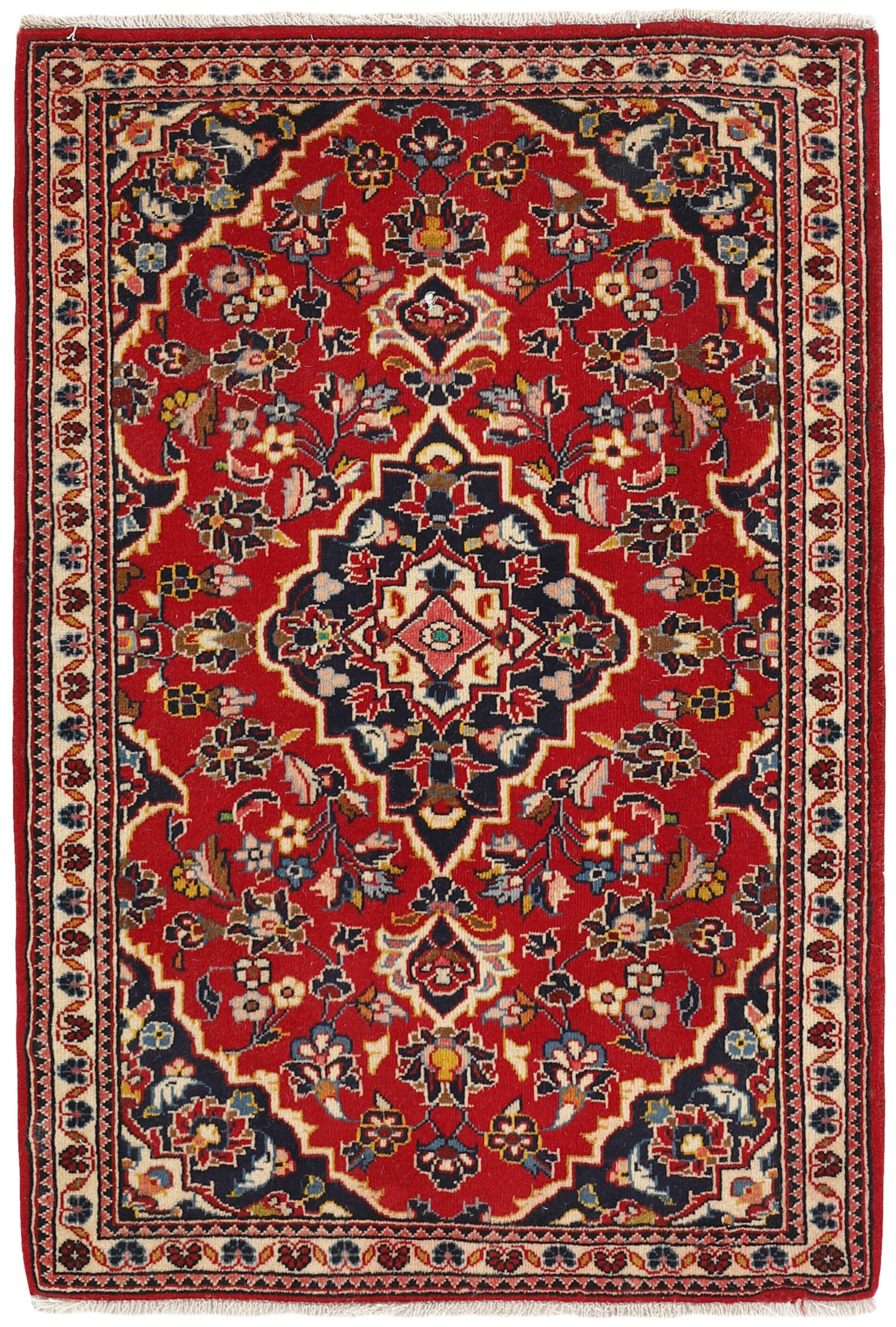 Traditional bordered Keshan rug with red background