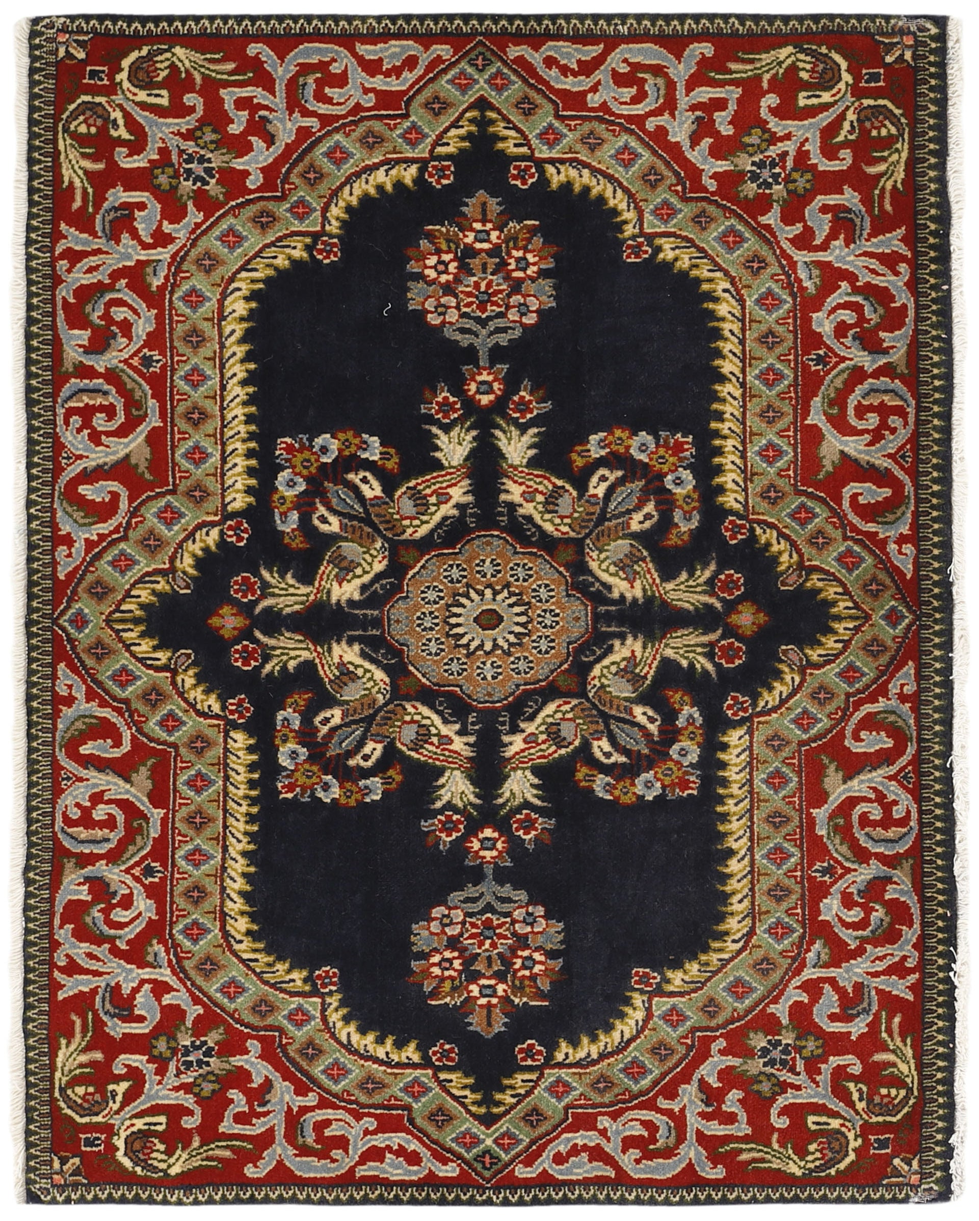 Traditional bordered Keshan rug with red background