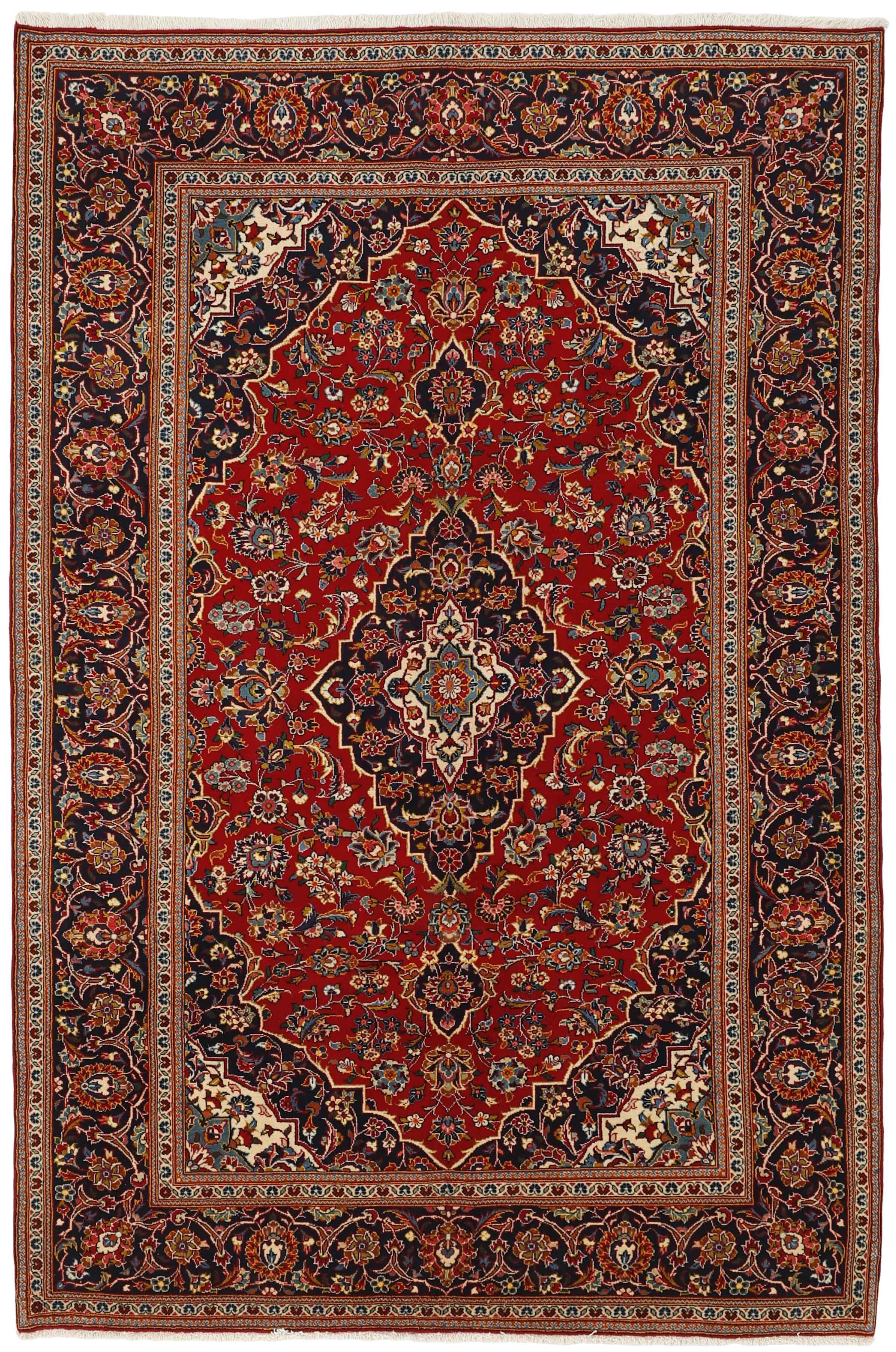 Traditional bordered Keshan rug with red background