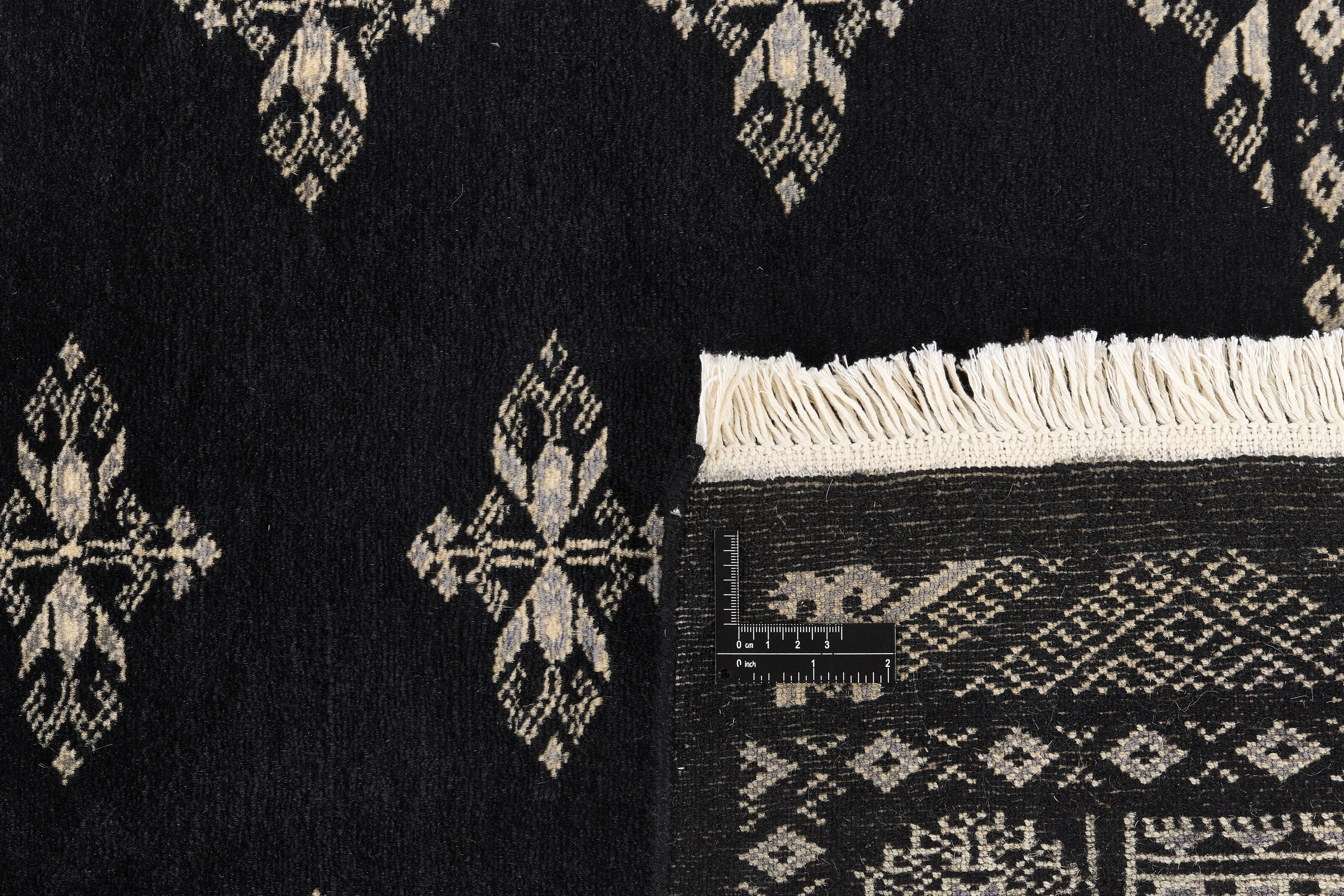 Black Oriental runner with traditional bordered pattern