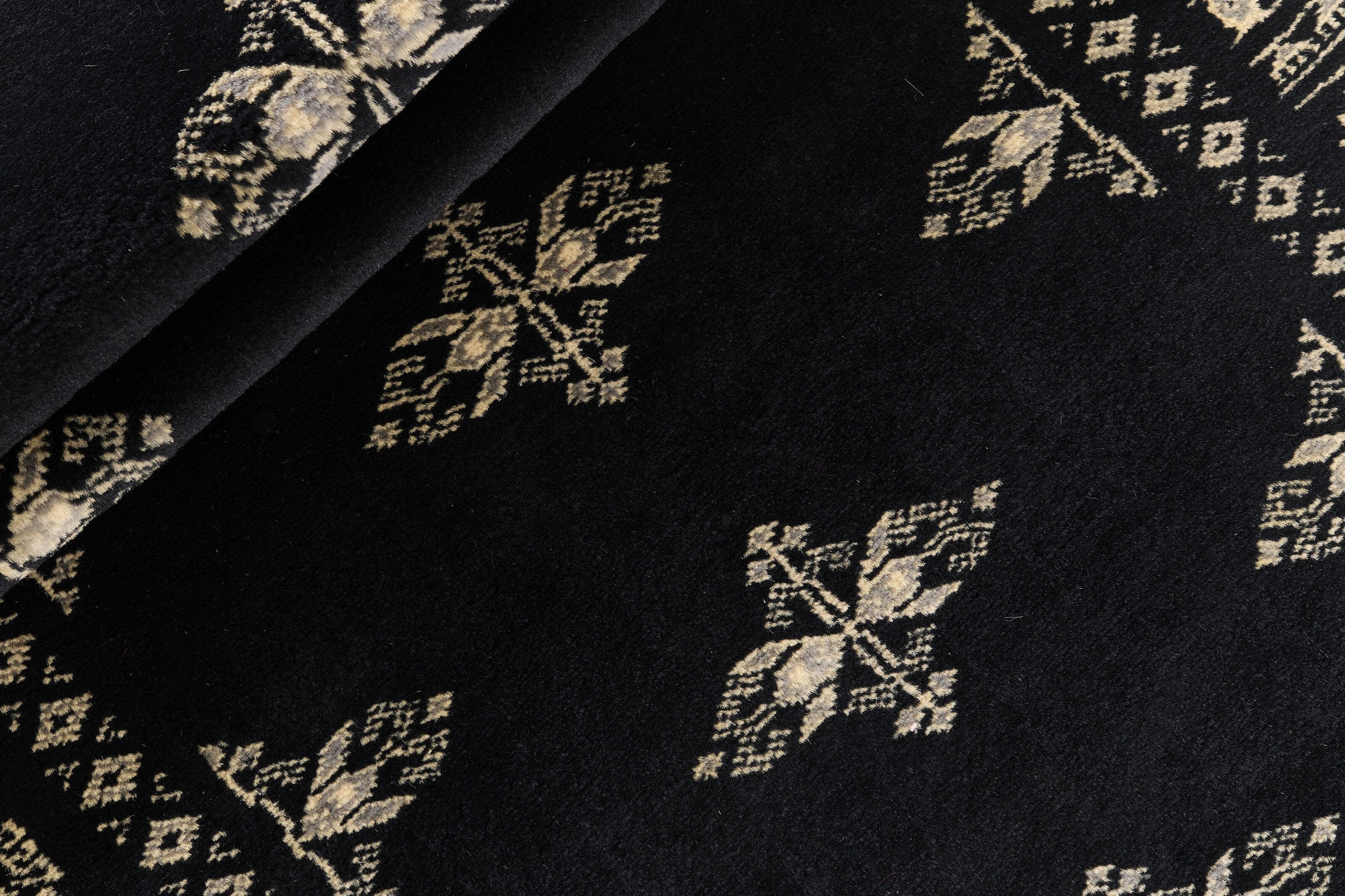 Black Oriental runner with traditional bordered pattern