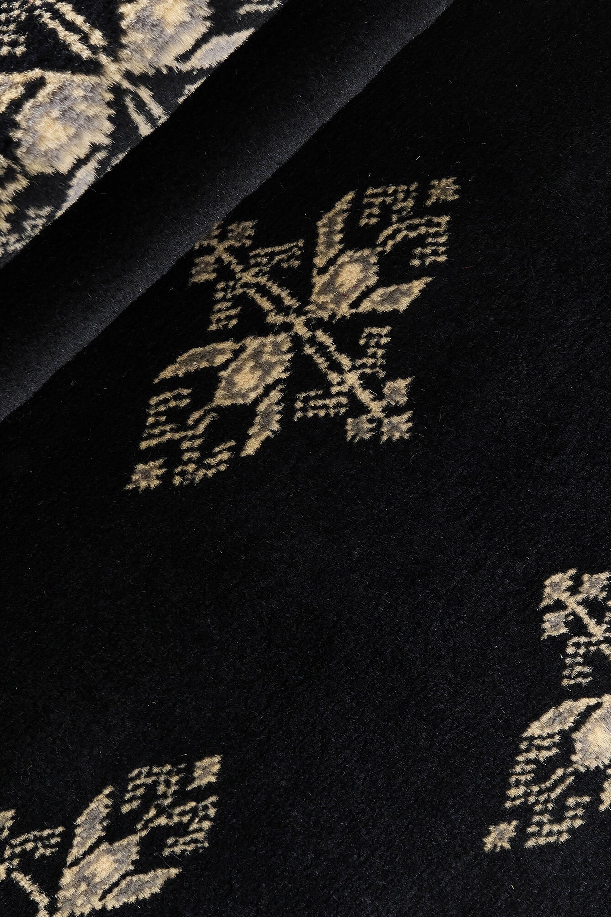 Black Oriental runner with traditional bordered pattern