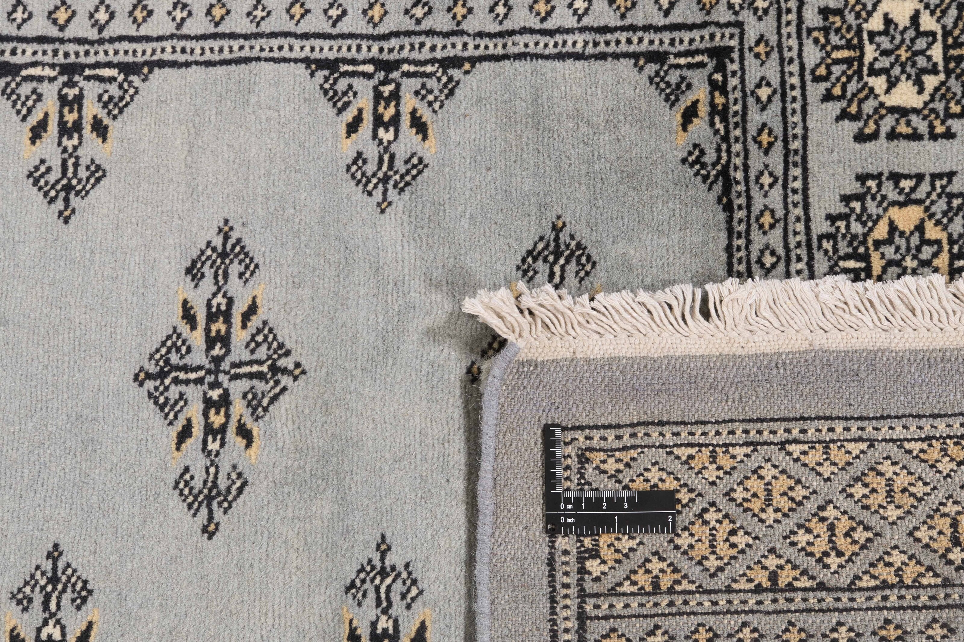 Grey Oriental runner with traditional bordered pattern