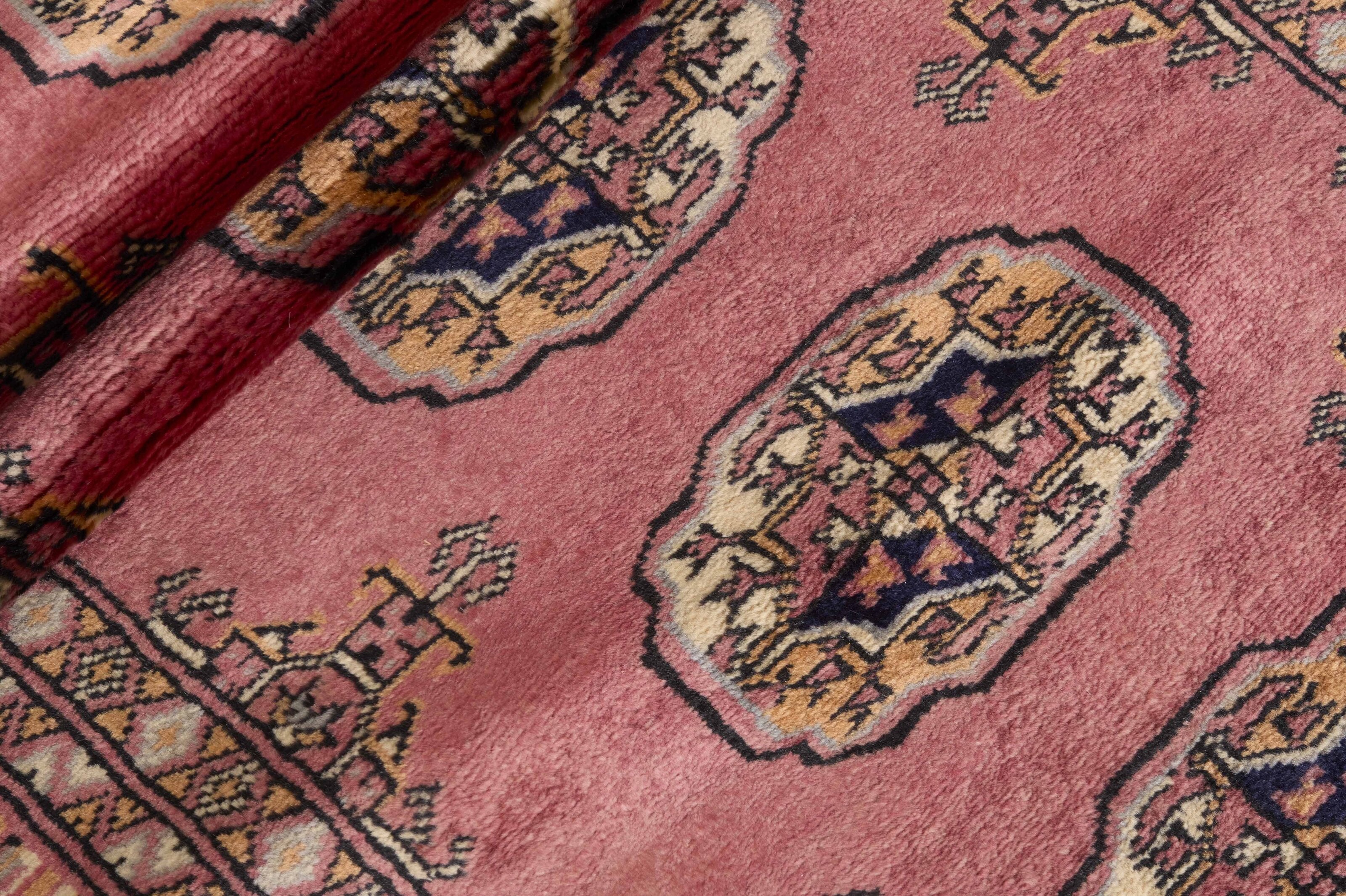 Red Oriental runner with traditional bordered pattern