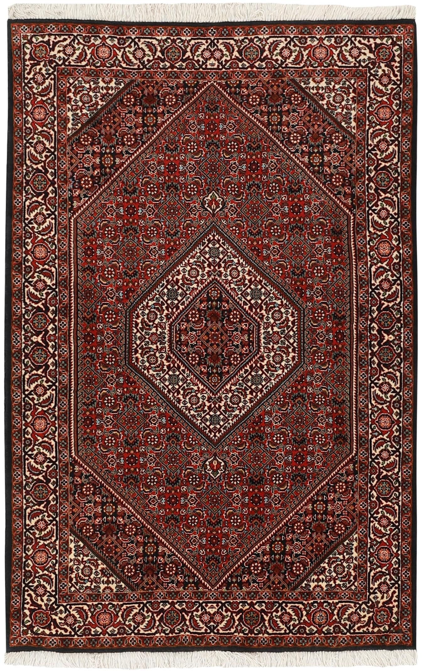 red and cream persian rug with traditional floral design