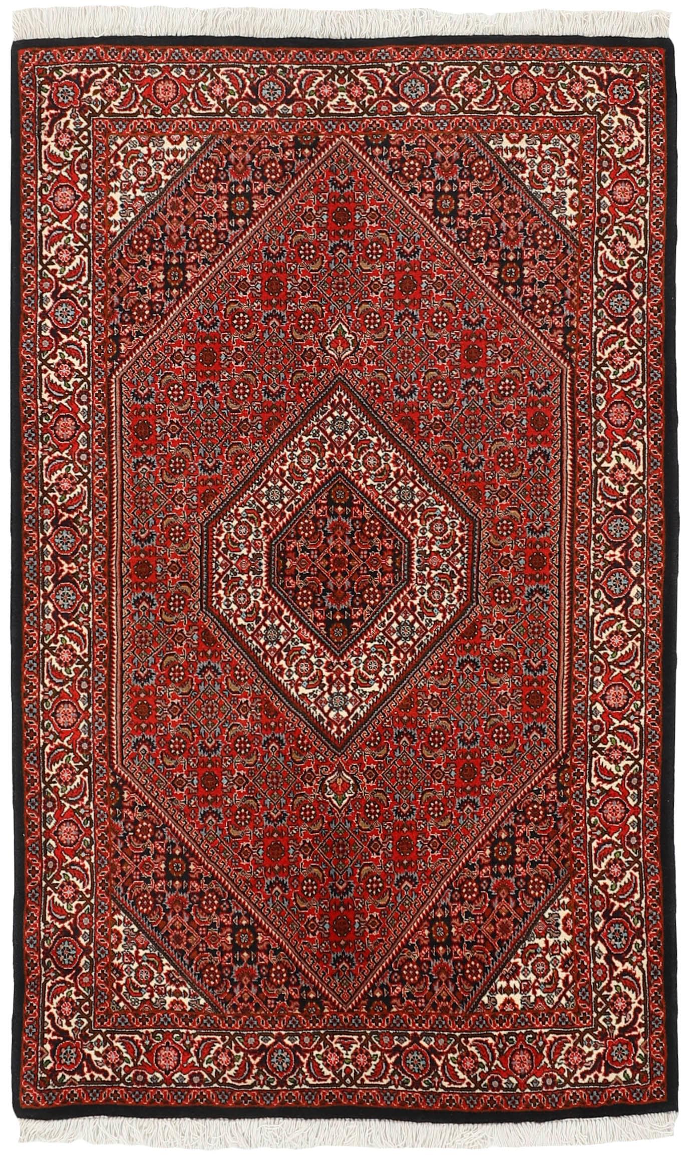 red and cream persian rug with traditional floral design