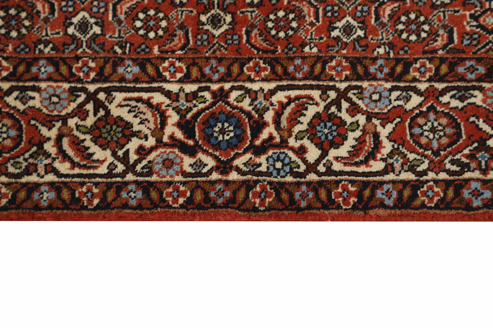 Red and cream persian runner with traditional floral design
