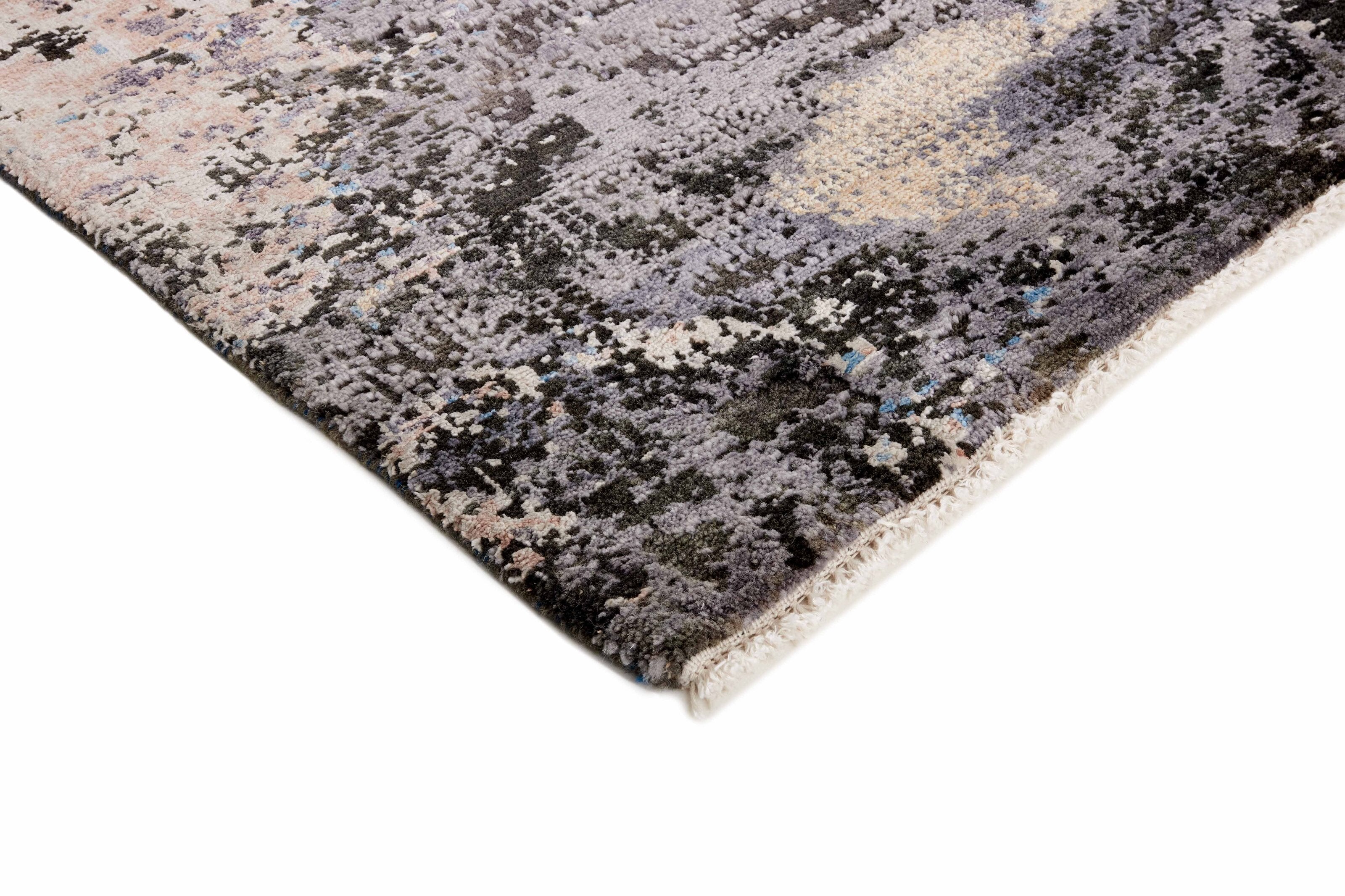 Large area rug with abstract design in grey, beige and blue