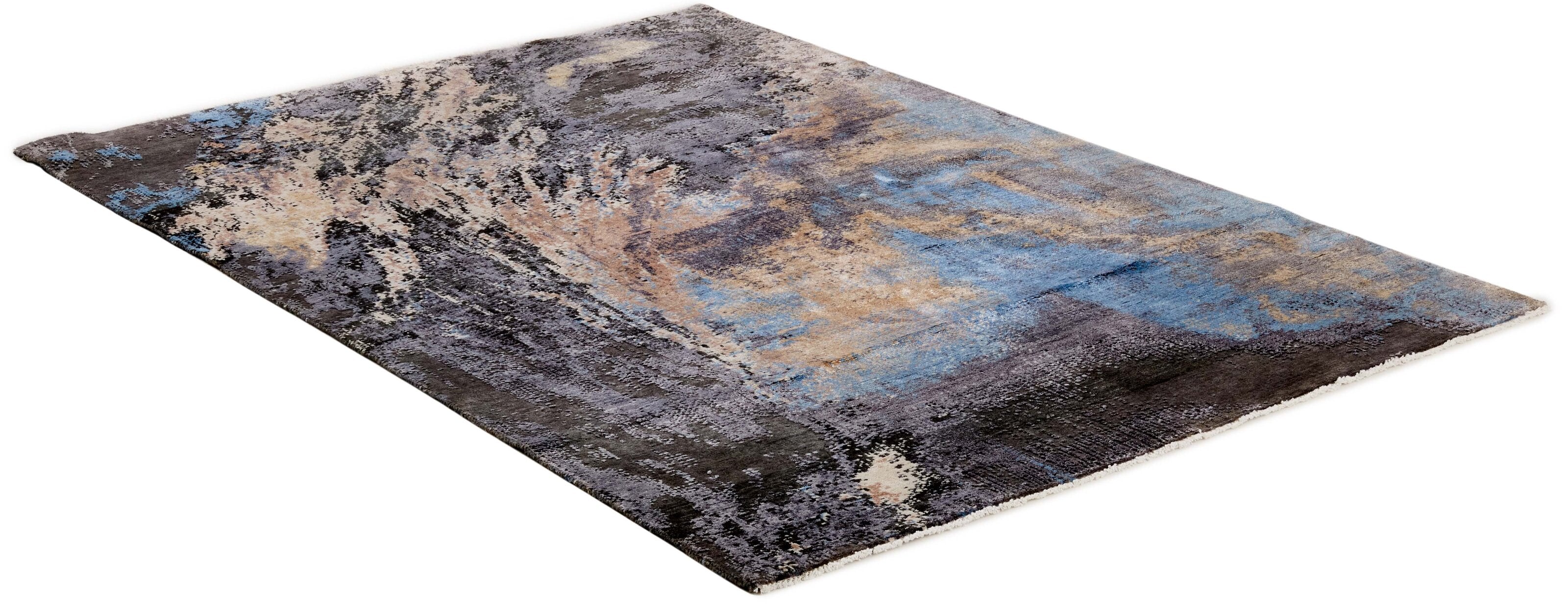 Large area rug with abstract design in grey, beige and blue