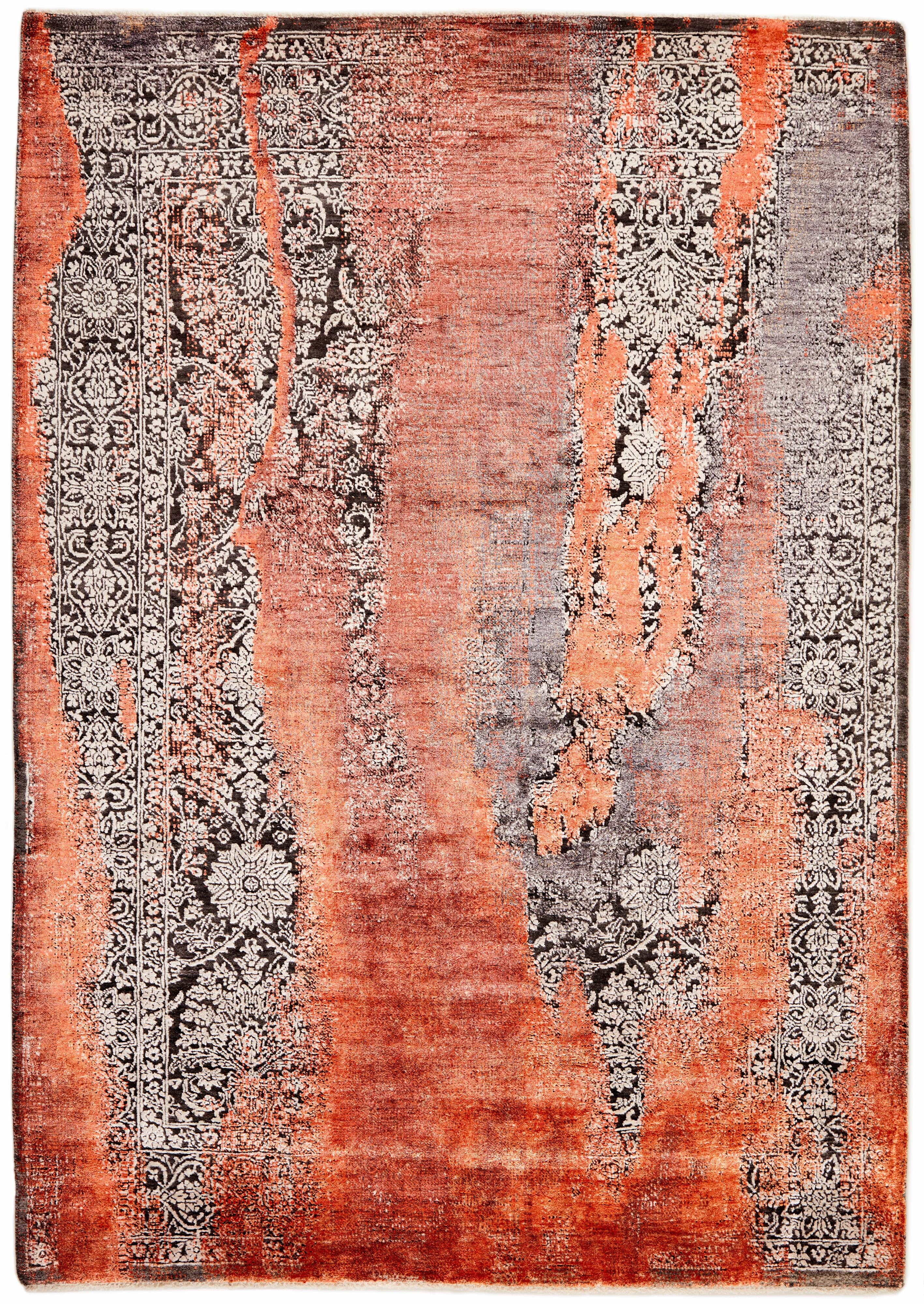 Large area rug with abstract design in orange, beige and brown
