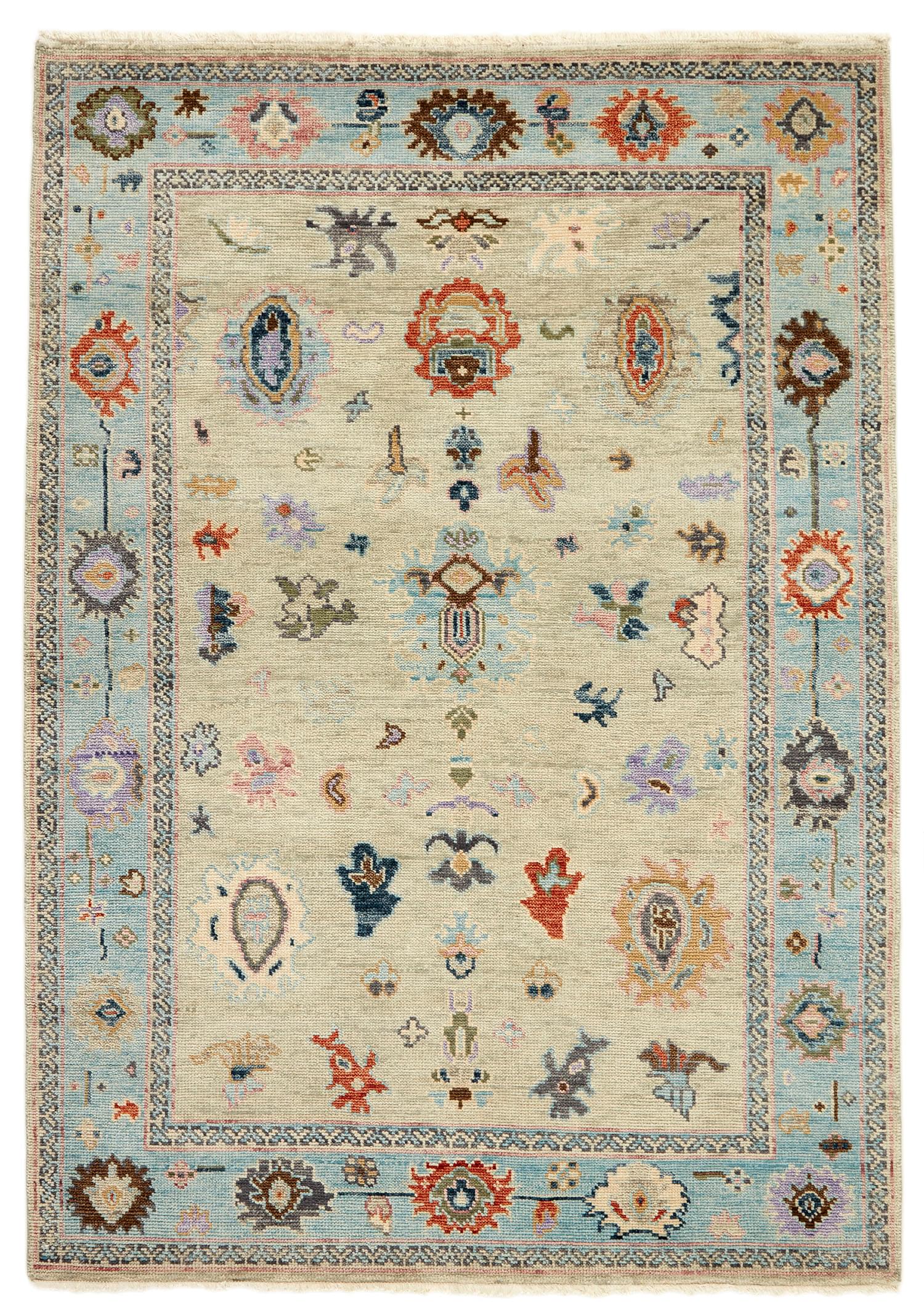authentic Oriental rug with traditional motifs in red, pink, yellow, blue, green, purple, beige and brown