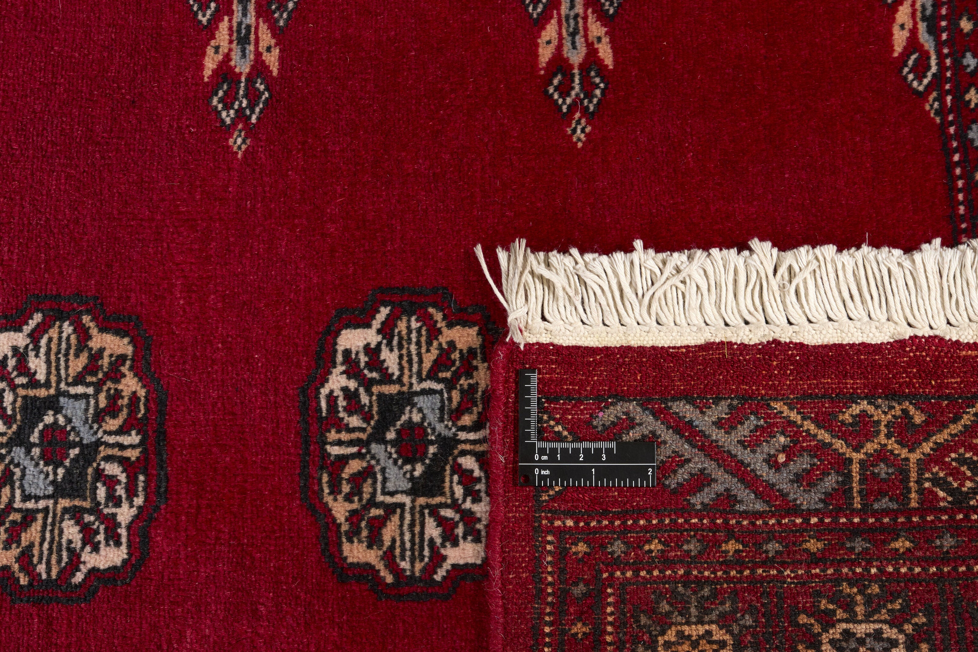 Red Oriental runner with traditional bordered pattern