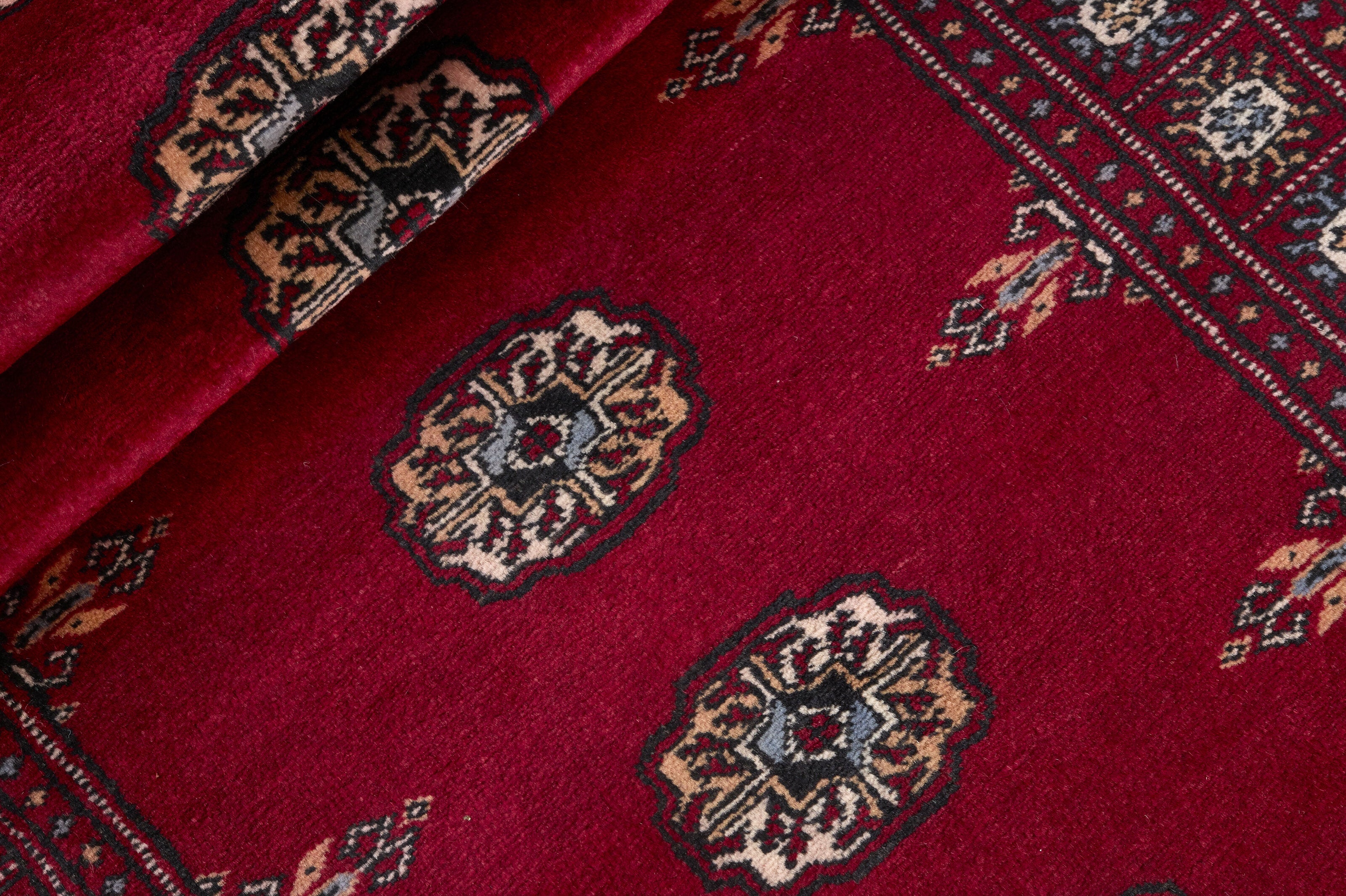 Red Oriental runner with traditional bordered pattern