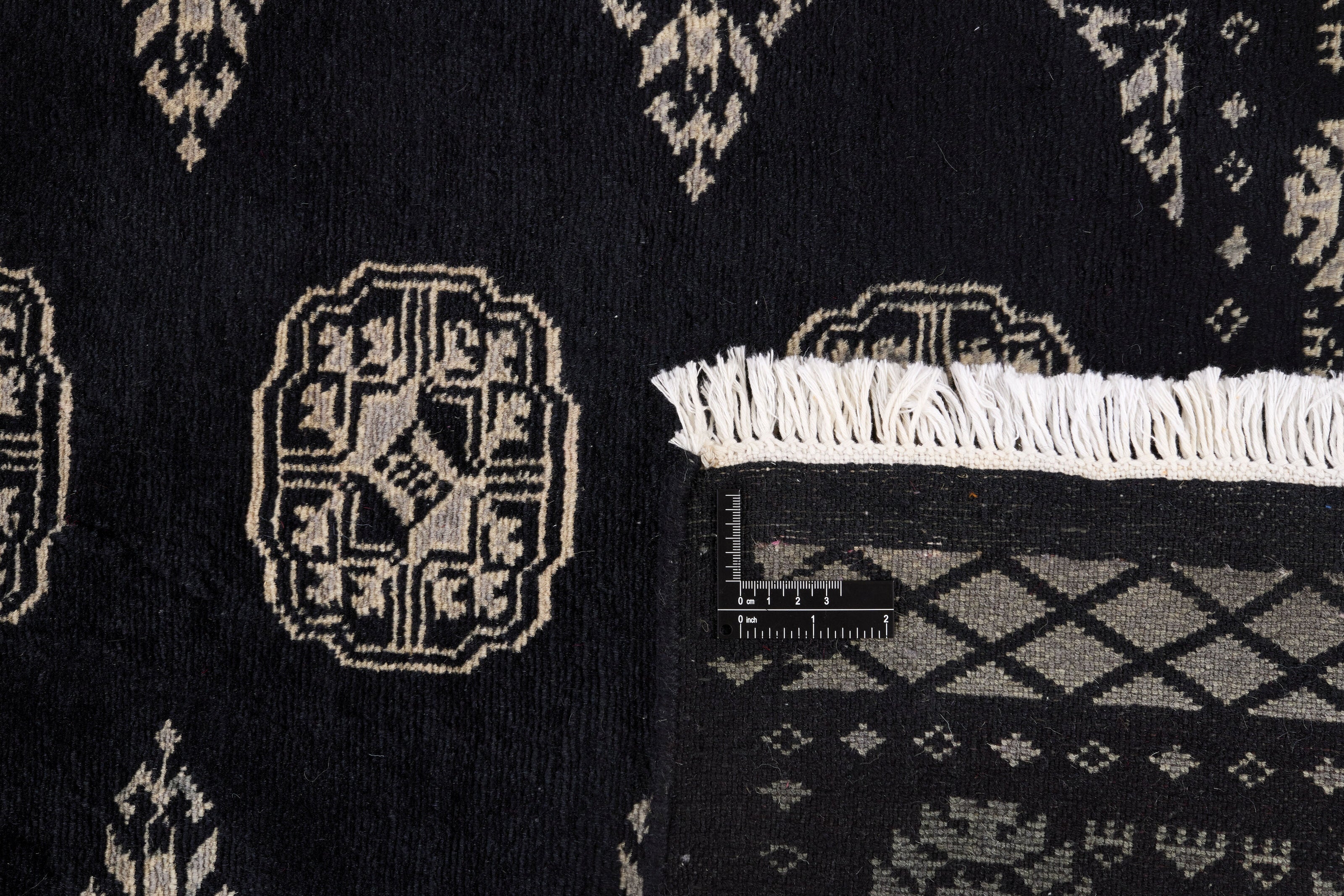 Black Oriental runner with traditional bordered pattern