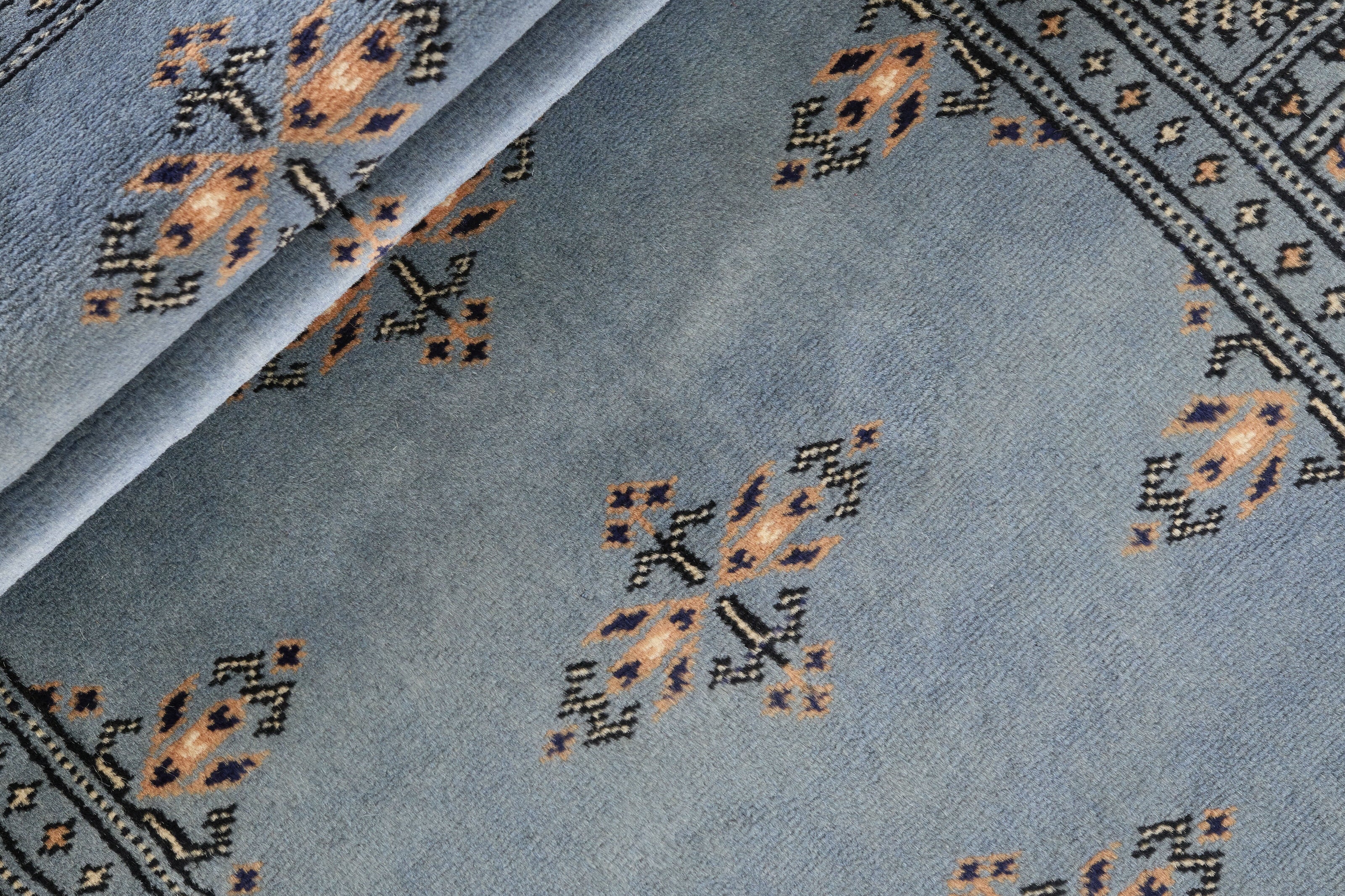 Blue Oriental runner with traditional bordered pattern