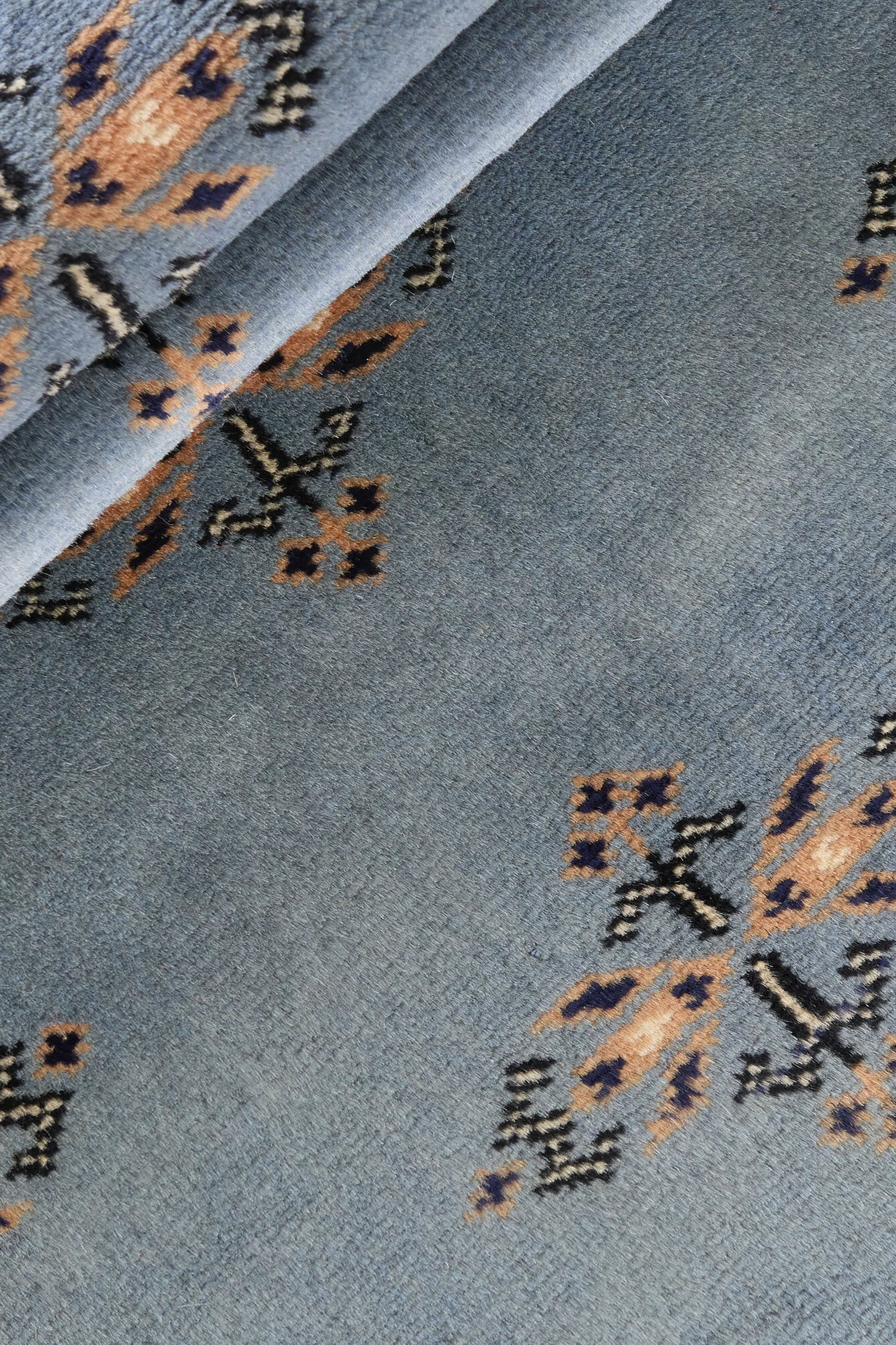 Blue Oriental runner with traditional bordered pattern